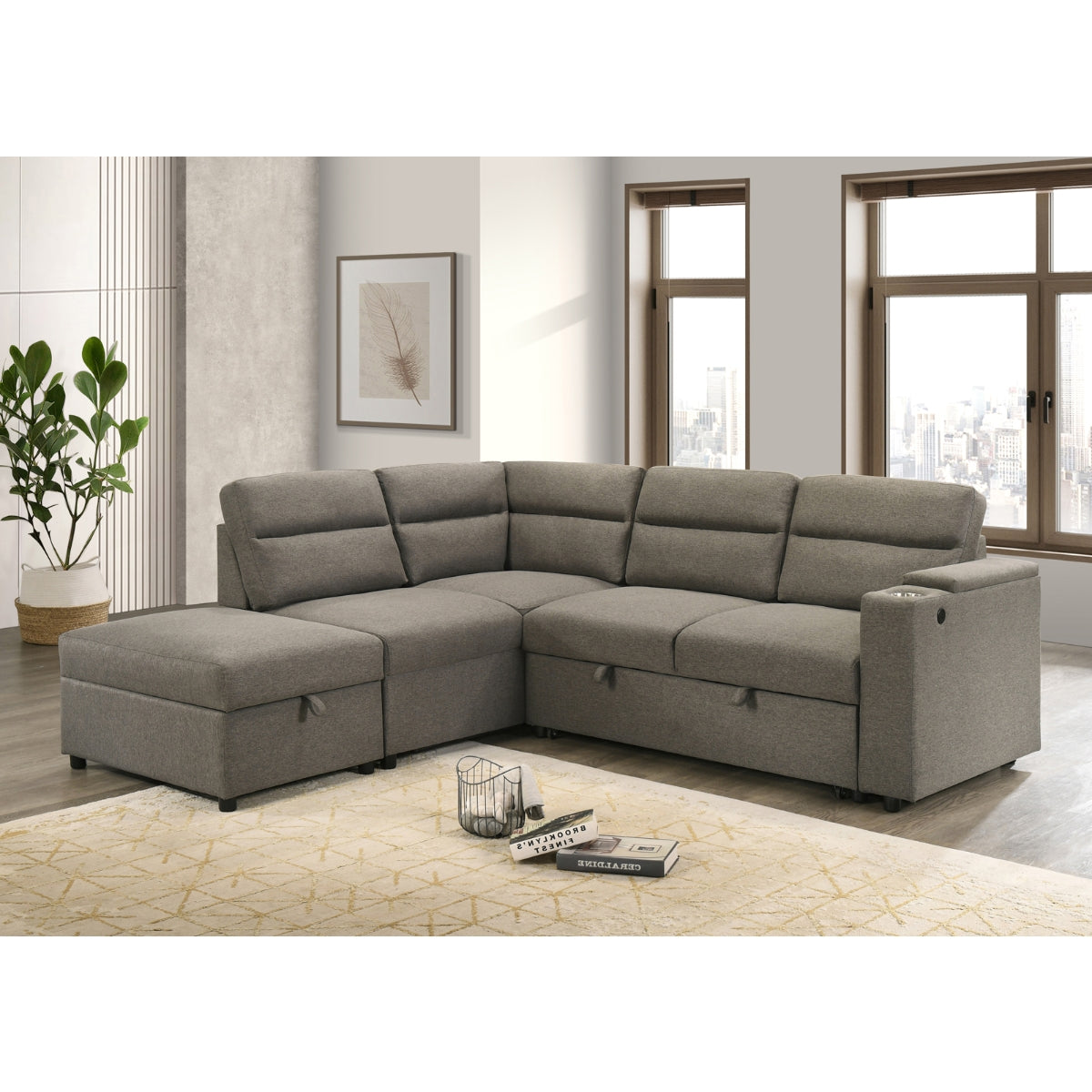 Maz Marasi 3-piece sectional sleeper with storage ottoman, featuring chaise and reversible sleeper, shown from an angled side view.