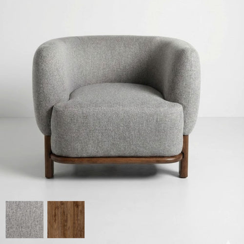 Xcella Florence accent chair in warm grey fabric with wooden legs, showcasing its stylish and comfortable design.