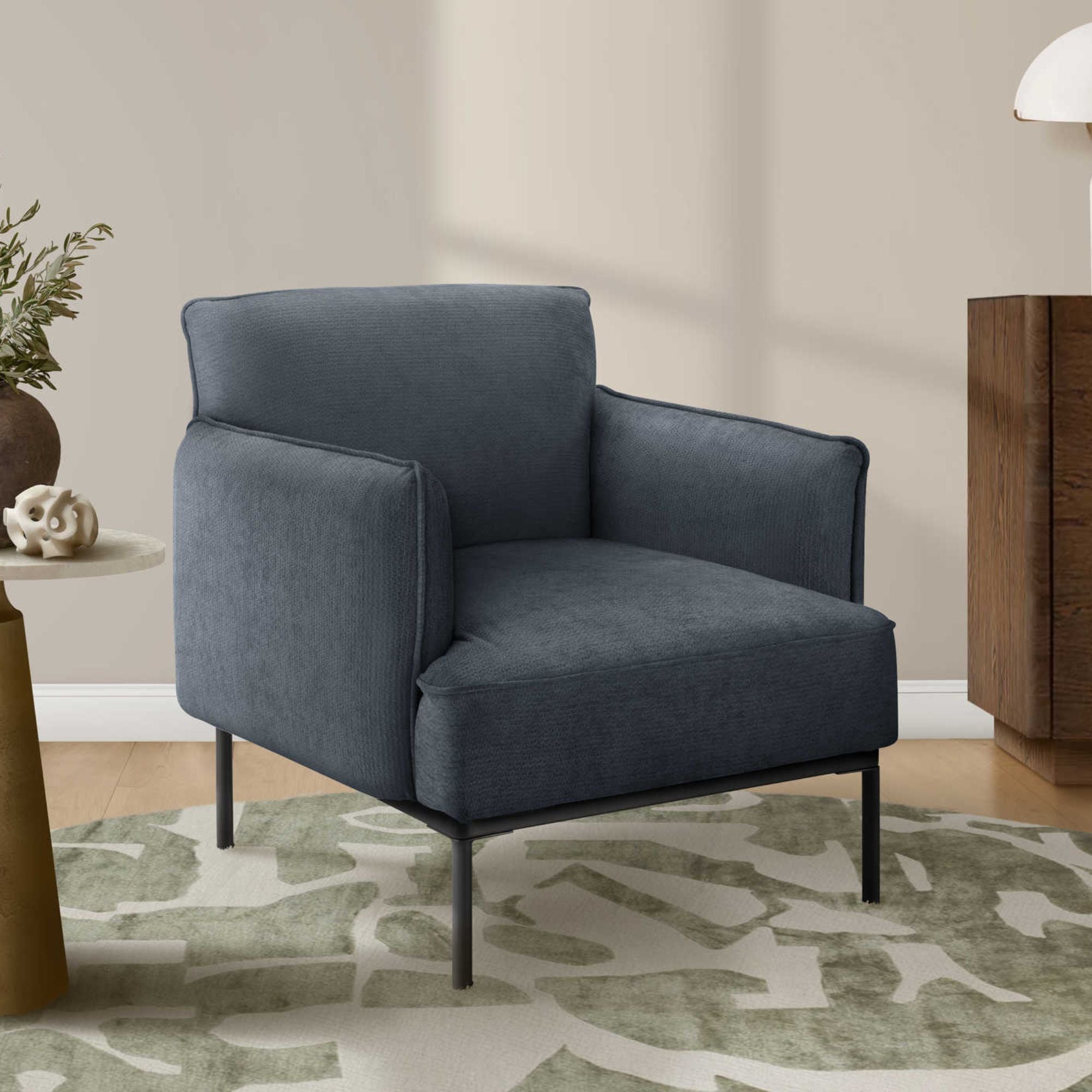 Blue fabric accent chair by Monarch Specialties with a 33-inch height, featuring a modern design and cushioned seat and back.
