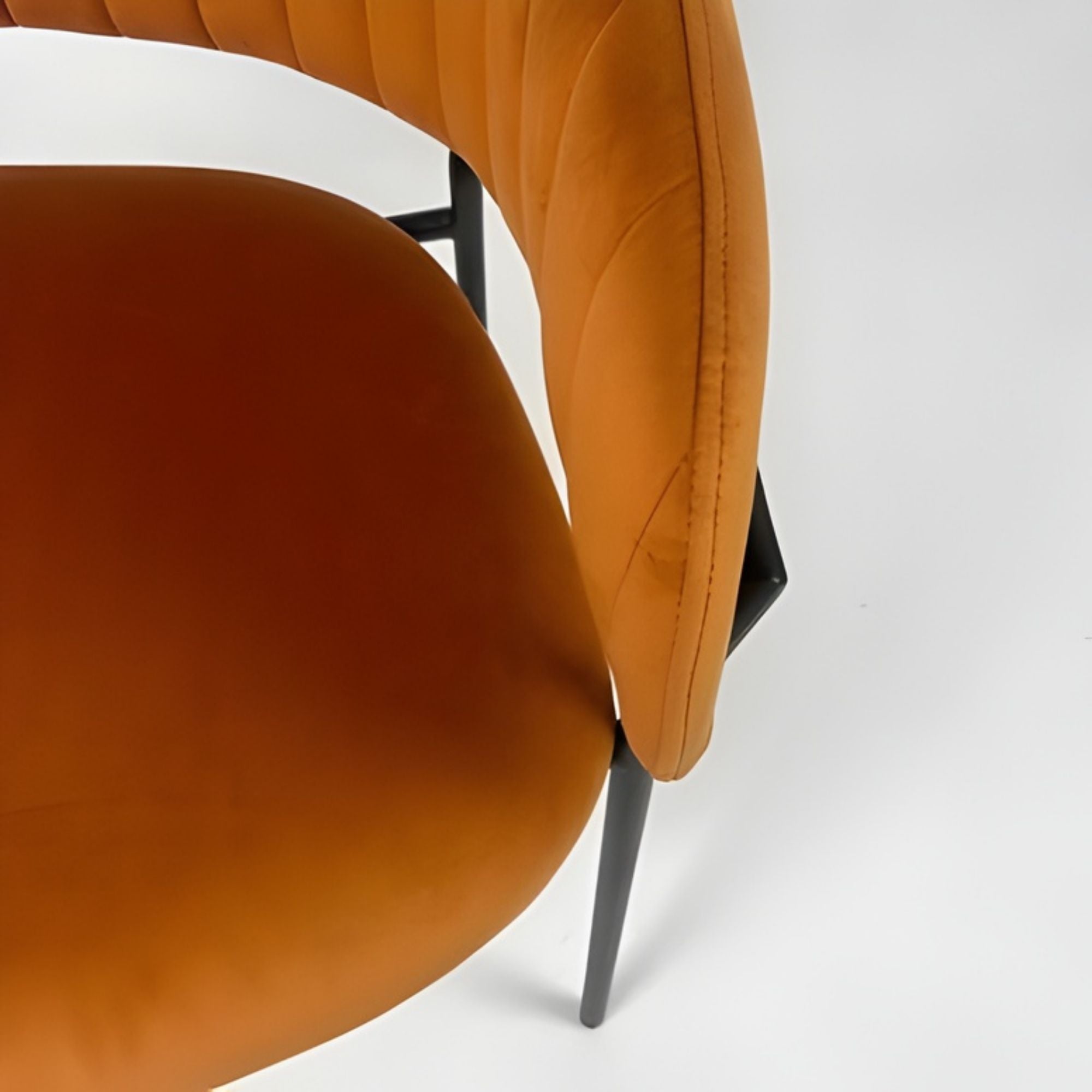 Set of two Amanda dining chairs by Elite Living in vibrant orange fabric with sleek wooden legs and modern design.