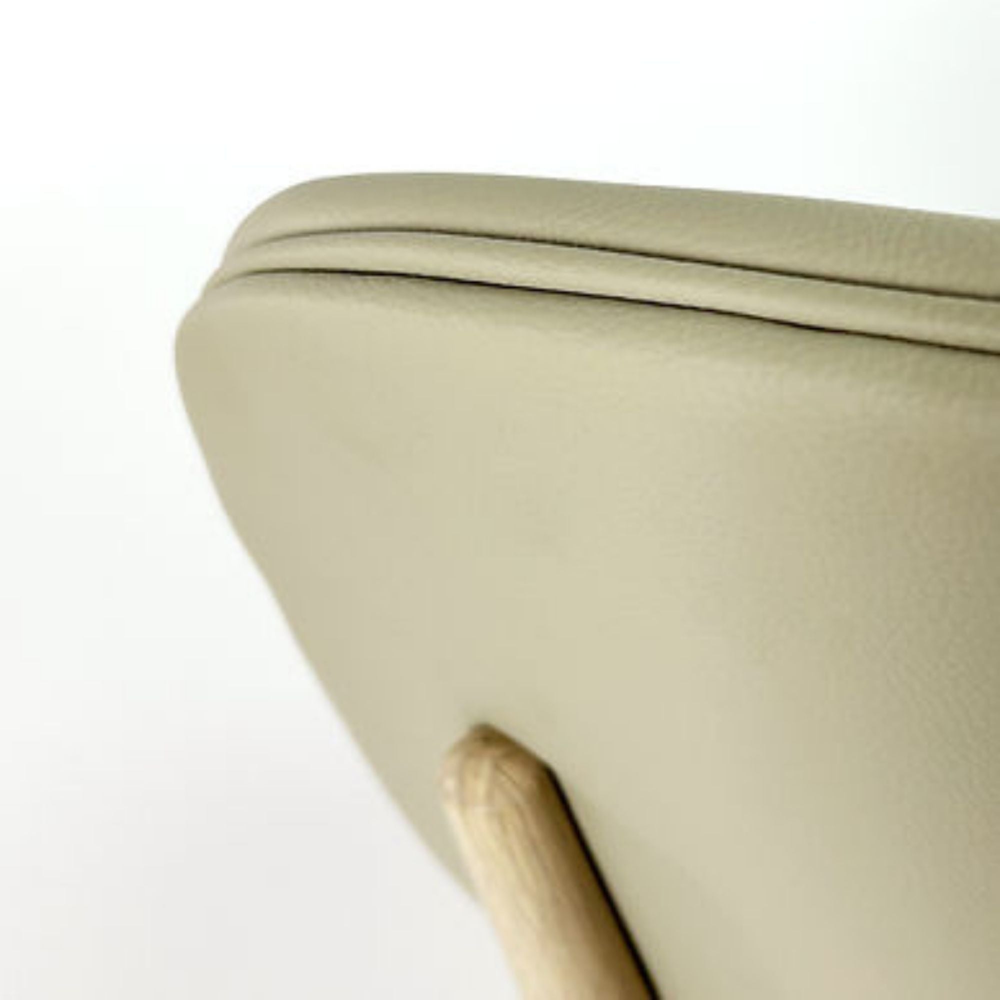 Beige Anton dining chair by Elite Living featuring a modern design with a cushioned seat and wooden legs.