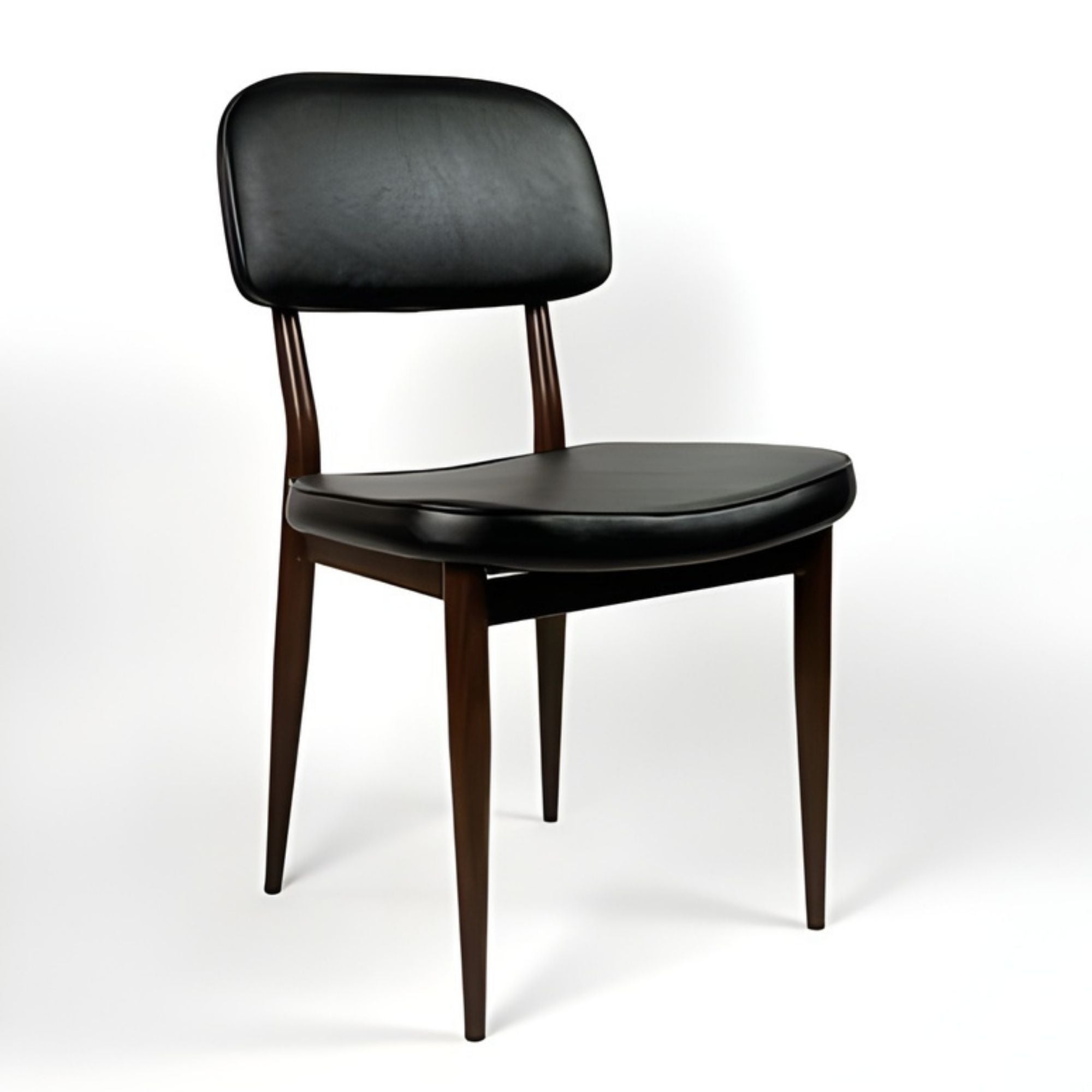 Black Anton dining chair by Elite Living, showcasing sleek design with a curved backrest and modern wooden legs.