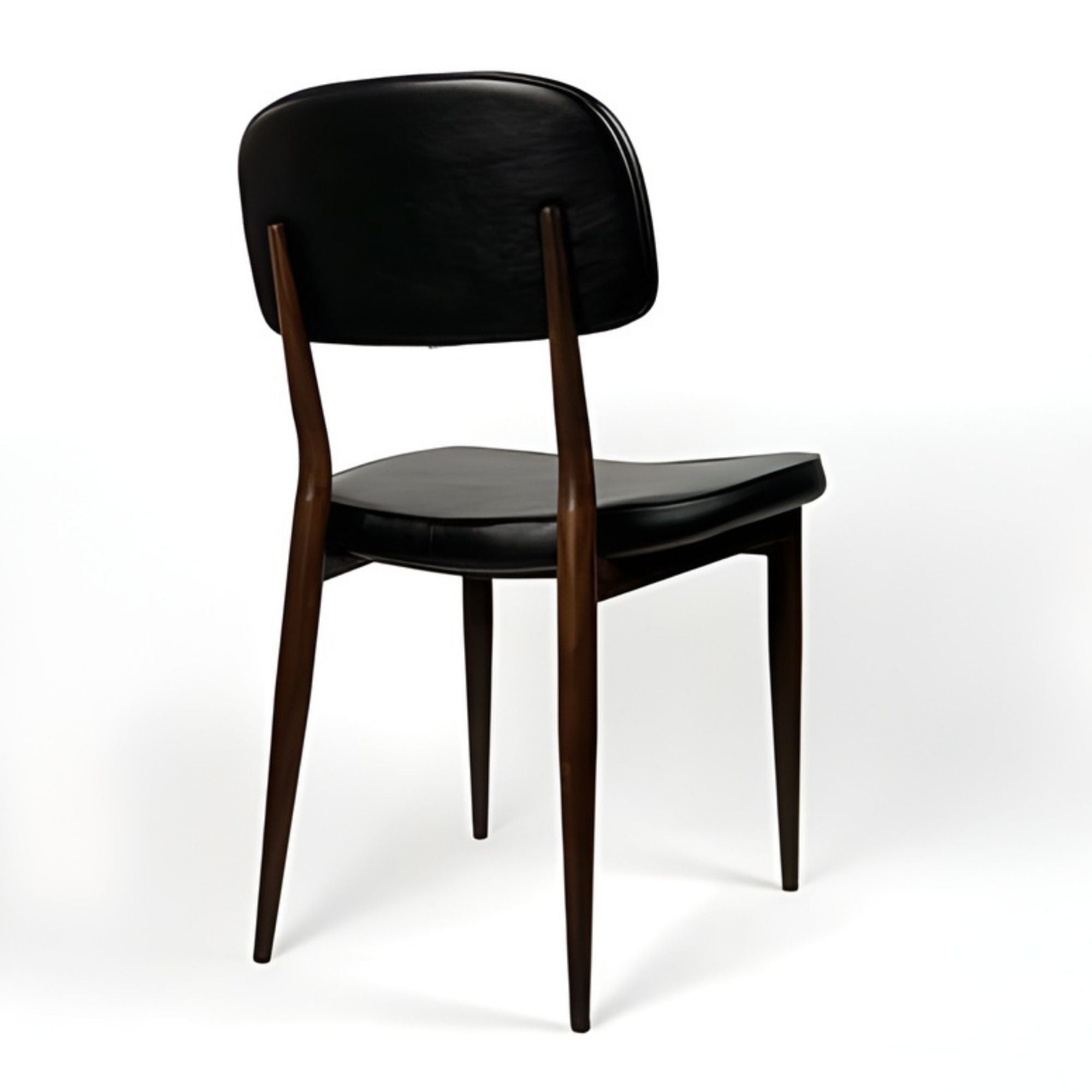 Black Anton dining chair by Elite Living, featuring a sleek design and comfortable seating, shown from a side angle.