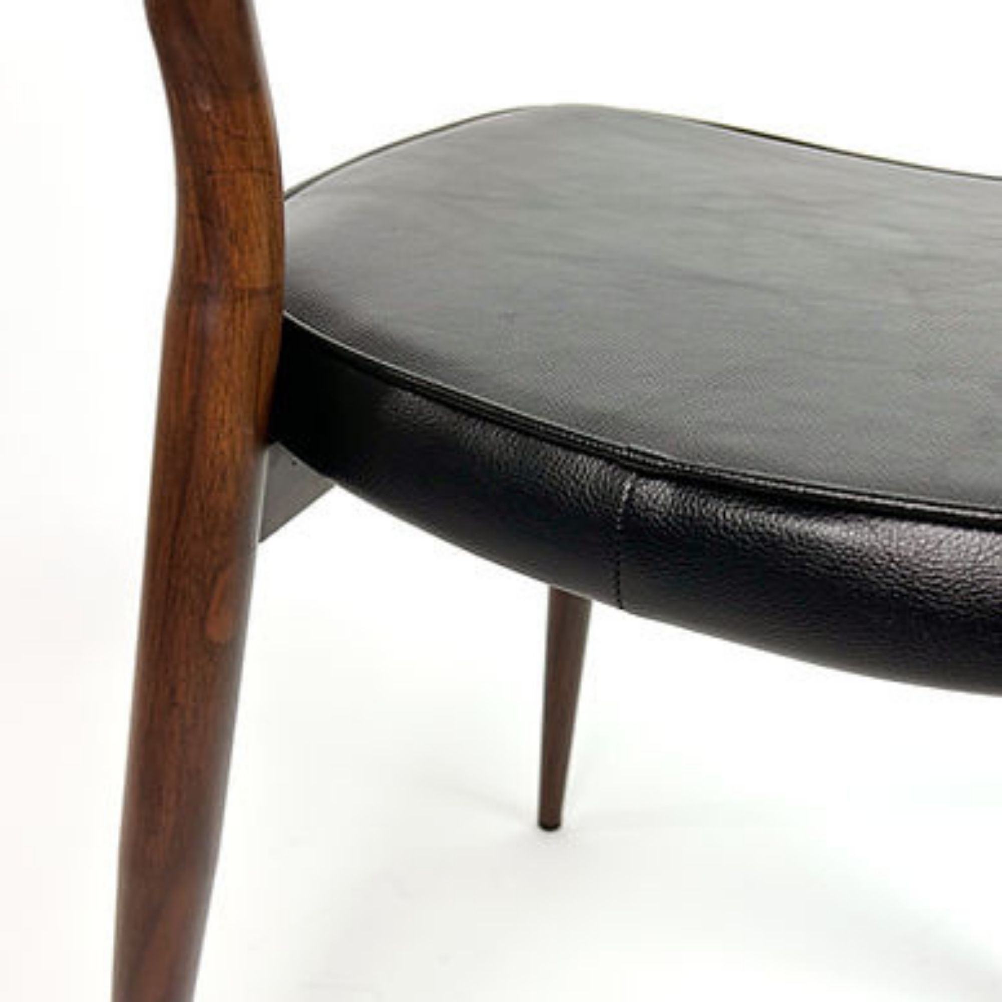 Black Anton dining chair by Elite Living, showcasing sleek design and comfortable seating with a modern aesthetic.