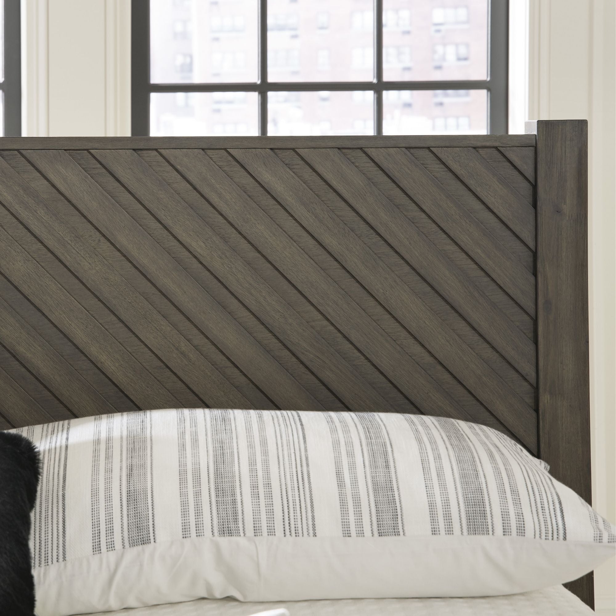 Grayish brown Arkenton panel bed by Signature Ashley featuring built-in USB ports for convenient charging.