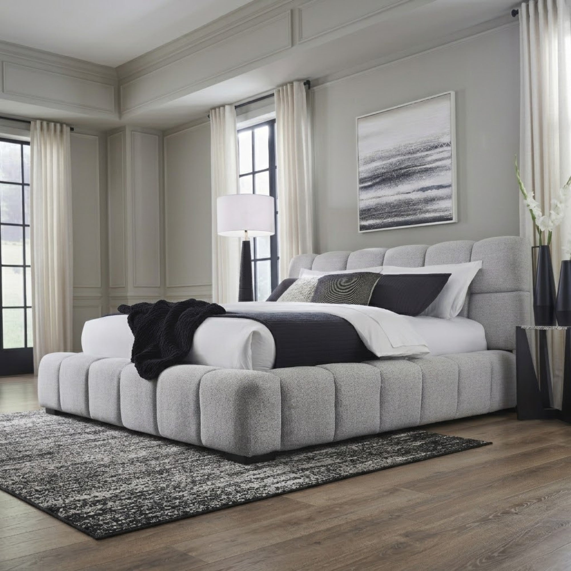 Light gray upholstered Ashley bed by Signature Ashley with a plush headboard and modern design, perfect for a stylish bedroom.
