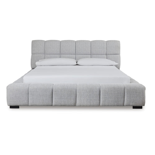 Light gray upholstered bed from Signature Design by Ashley, showcasing a modern bed frame with plush headboard and clean design.