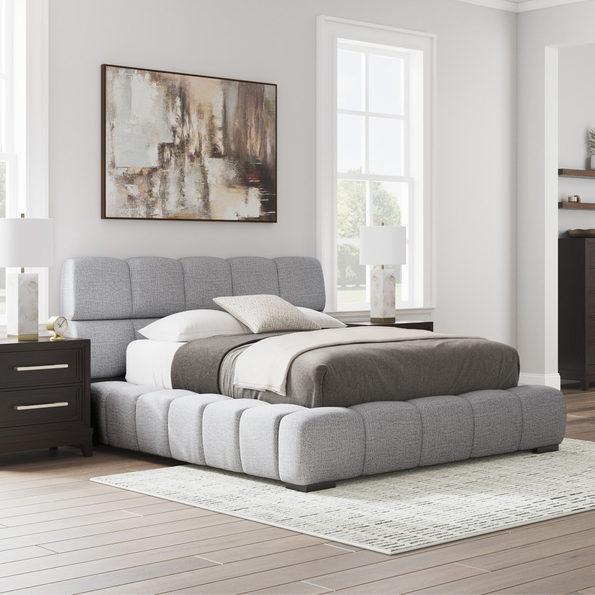 Light gray upholstered Ashley bed from the Grendusk collection featuring a padded headboard and modern design.