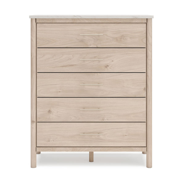 Signature Ashley Cadmori five-drawer wide natural wood chest with sleek design and spacious storage.