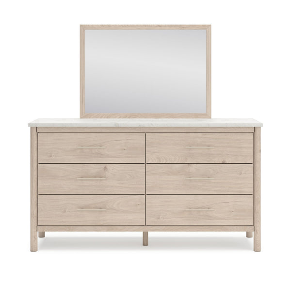 Signature Ashley Cadmori dresser and mirror set in natural finish, showcasing a stylish bedroom furniture collection.