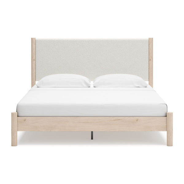 Natural upholstered panel platform bed from Signature Ashley, featuring a soft fabric headboard and sturdy frame in a bedroom setting.
