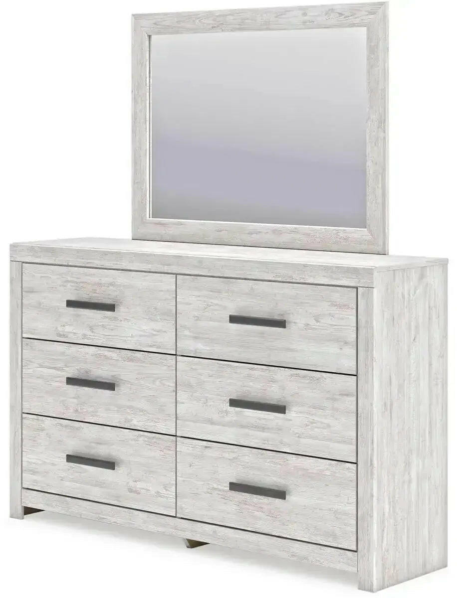 Signature Ashley Cayboni dresser and mirror set showing a modern wooden dresser with a matching mirror in a contemporary bedroom.