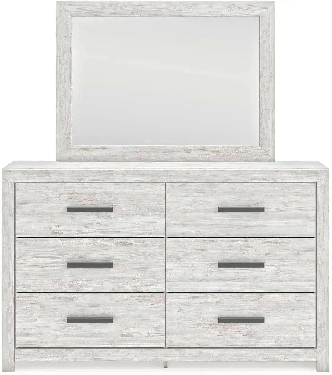 Signature Ashley Cayboni dresser and mirror set with sleek wood finish, showcasing the dresser's drawers and attached mirror.
