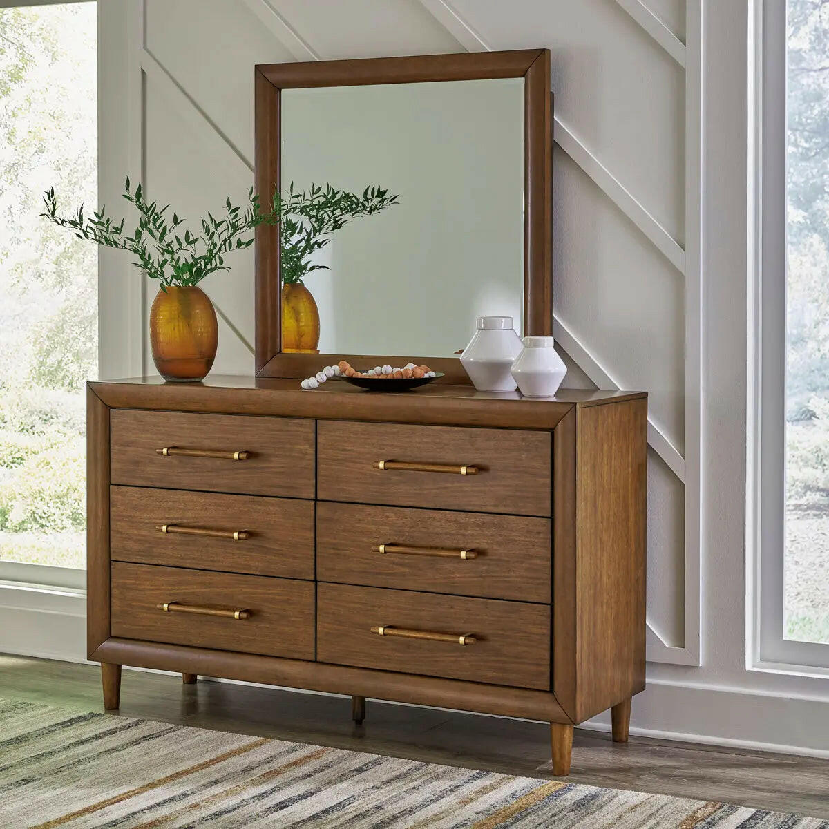 Signature Design by Ashley Lyncott upholstered panel bedroom set with bed frame and matching furniture, in a modern bedroom setting.