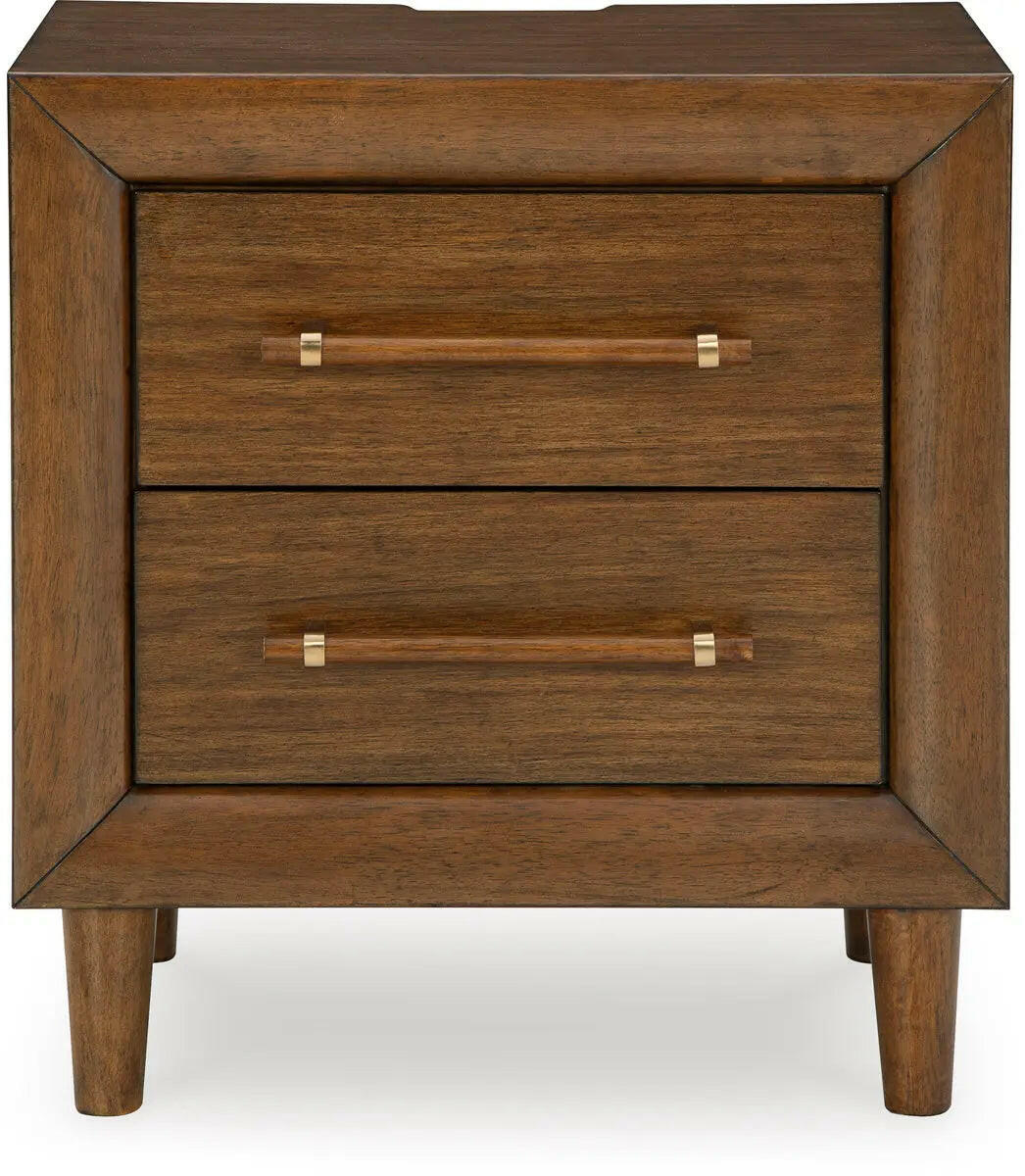 Signature Design by Ashley Lyncott upholstered panel bedroom set with a headboard, showcasing a modern bedroom furniture arrangement.