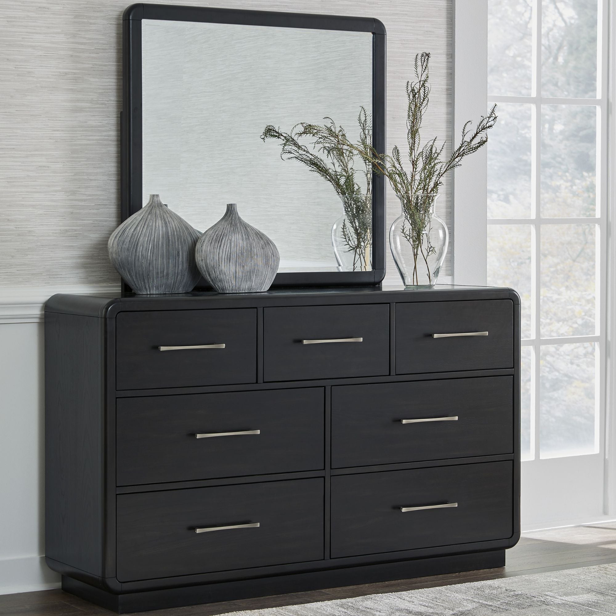 Signature Ashley Rowanbeck upholstered panel bedroom set with bed frame, headboard, and matching furniture in a modern bedroom setting.