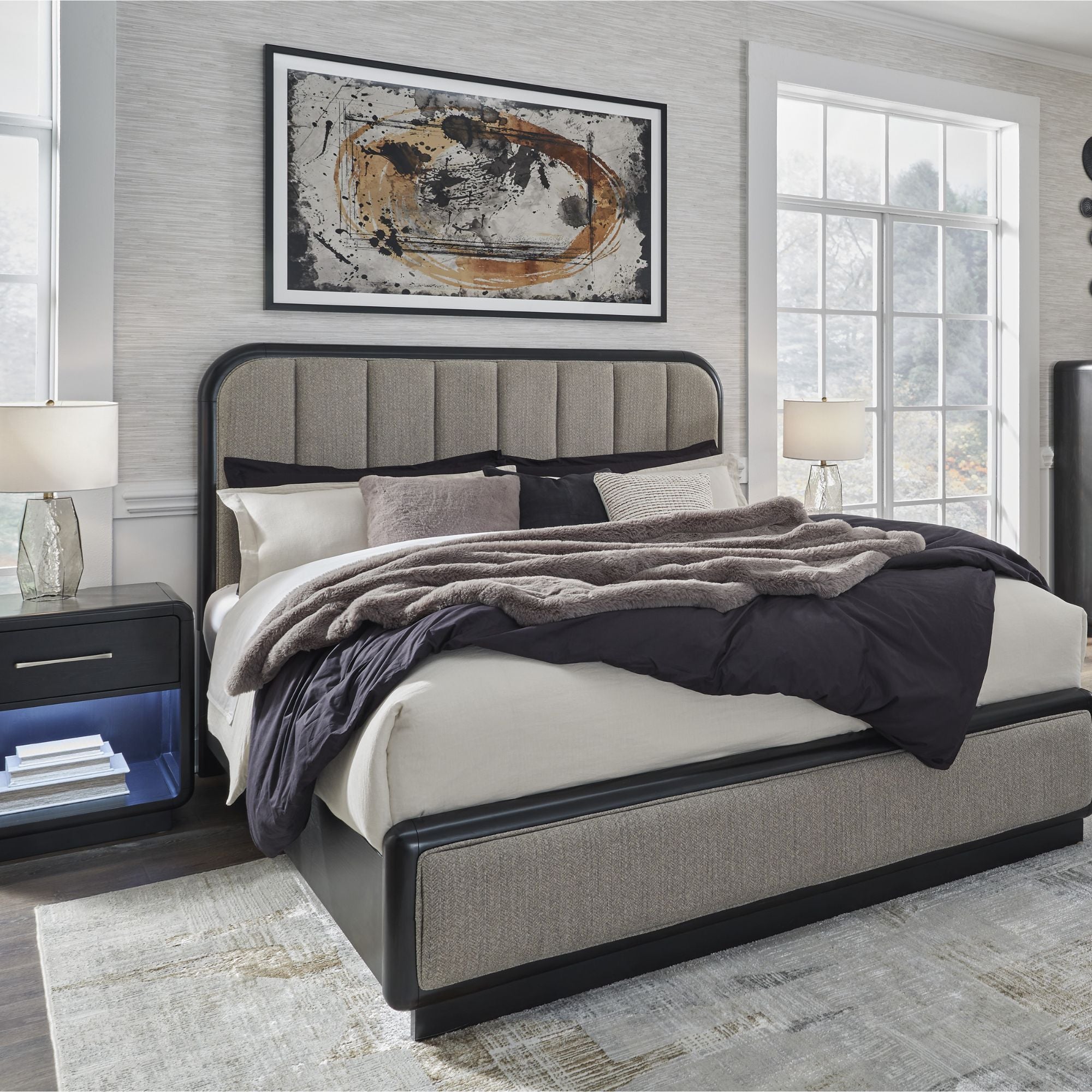 Signature Ashley Rowanbeck upholstered panel bedroom set featuring a bed frame with padded headboard and matching furniture pieces.