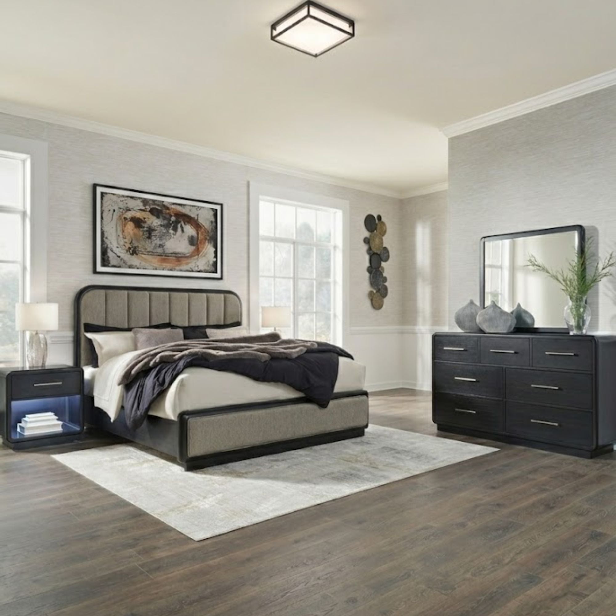 Signature Ashley Rowanbeck upholstered panel bedroom set with a bed and matching nightstands in a modern design.