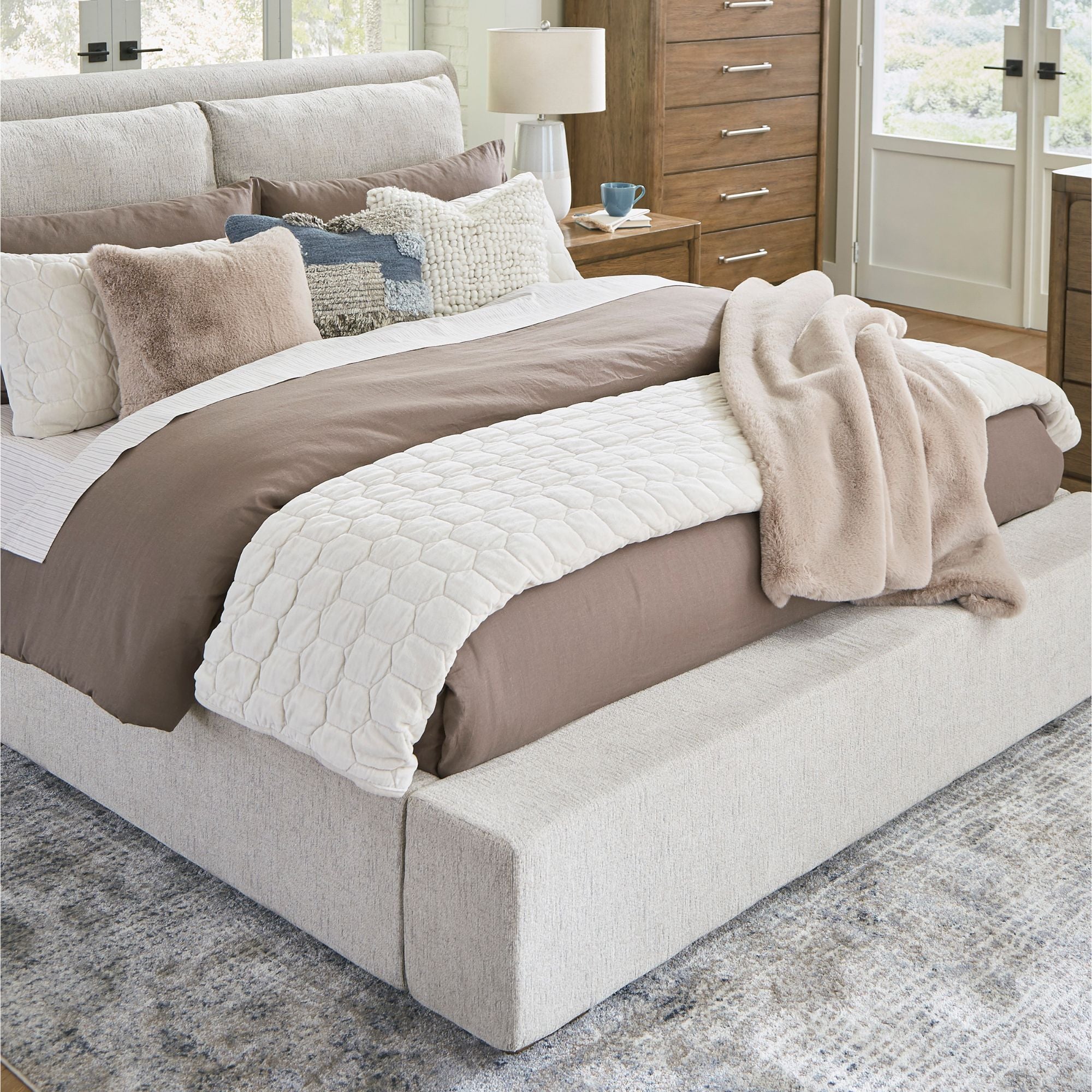 Signature Ashley Cabalynn upholstered bed with plush fabric, featuring a stylish headboard and sturdy frame for a cozy bedroom centerpiece.