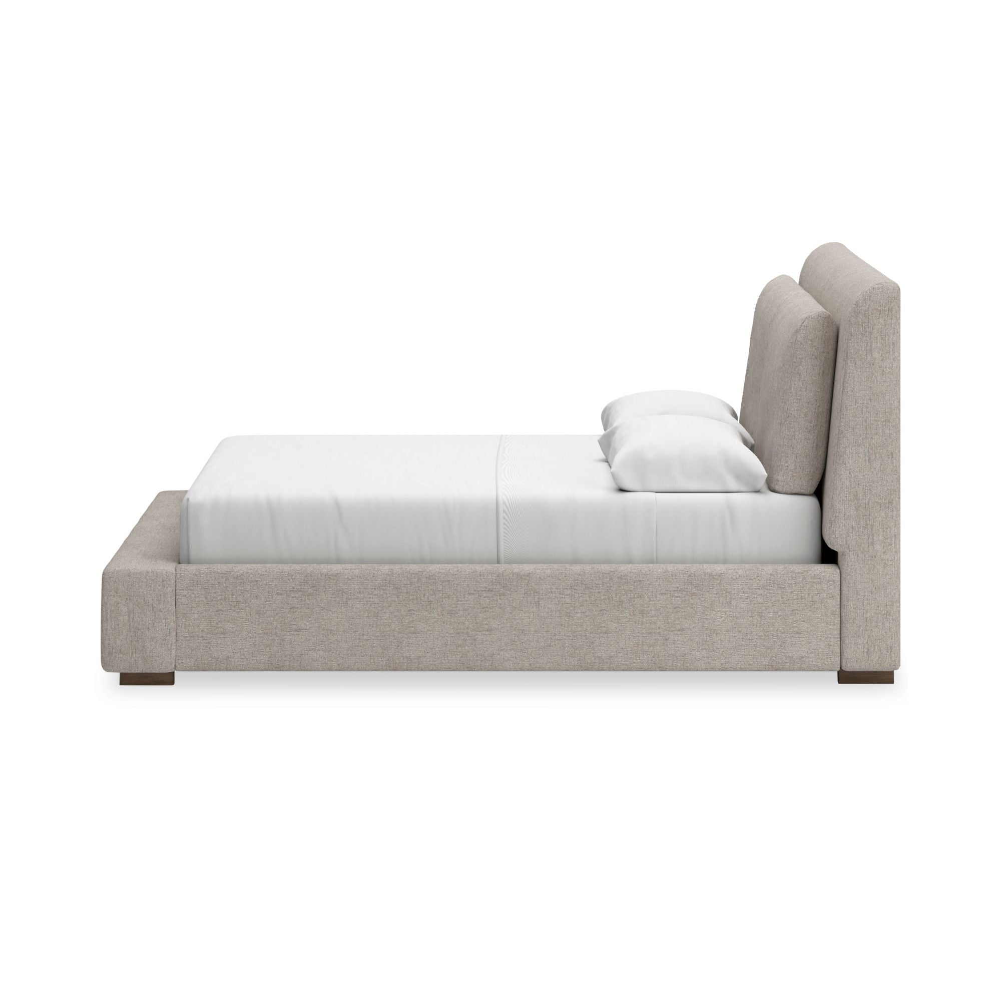 Signature Ashley Cabalynn upholstered bed with plush fabric and sleek design, shown in a stylish bedroom setting.