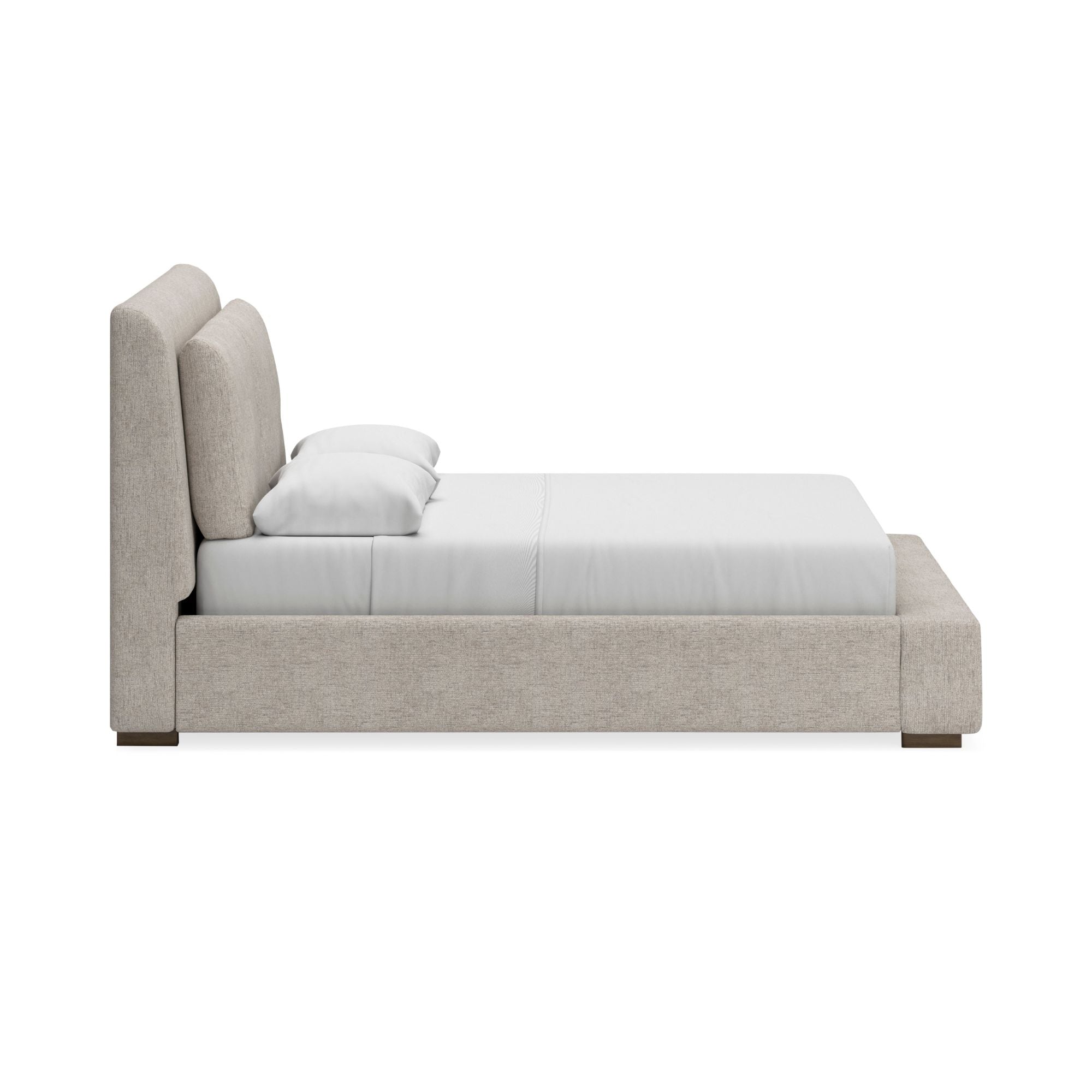 Signature Ashley Cabalynn upholstered bed with a plush headboard and neutral fabric, showcasing a stylish bedroom furniture piece.