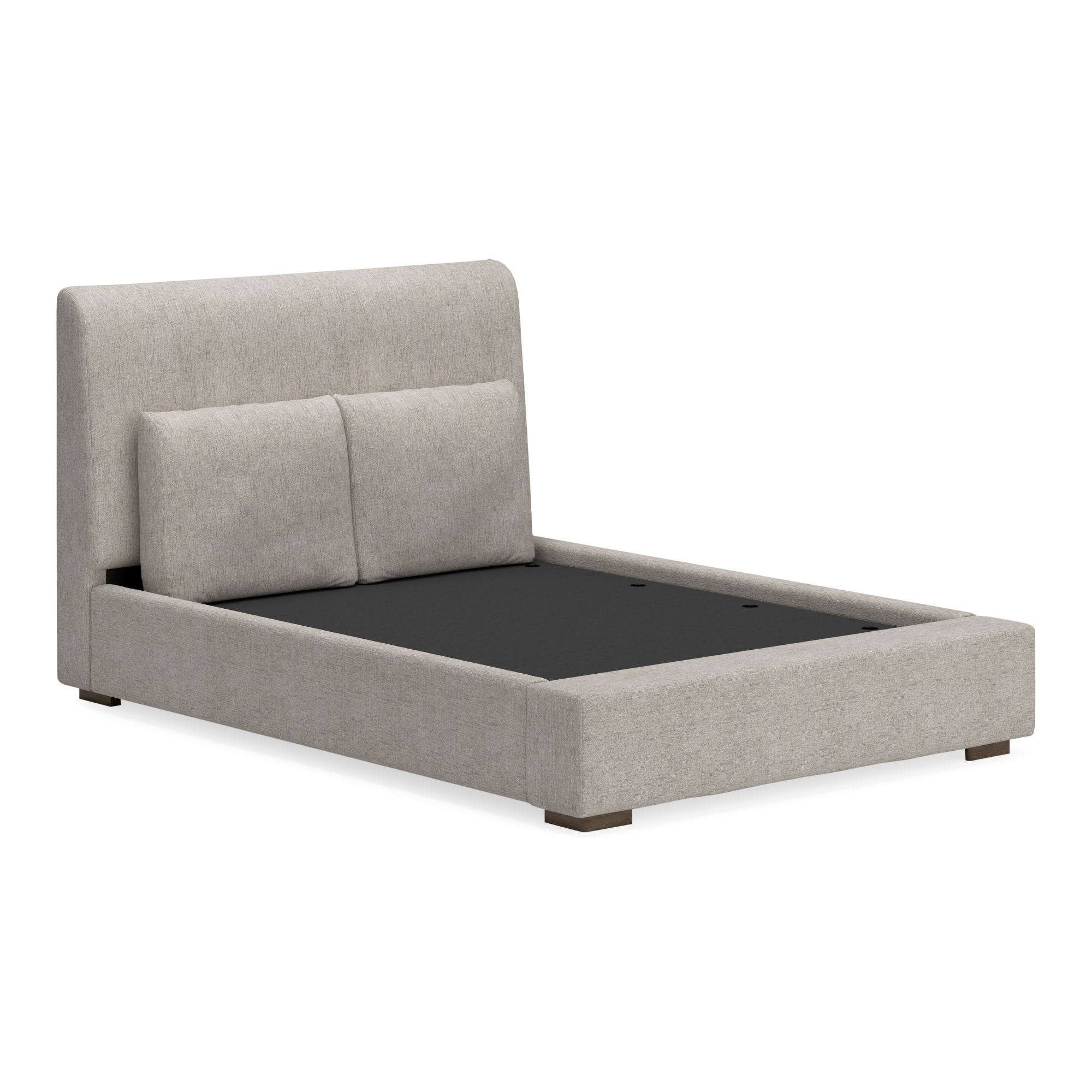 Signature Ashley Cabalynn upholstered bed with padded headboard and neutral fabric, showcasing a stylish and comfortable bedroom centerpiece.