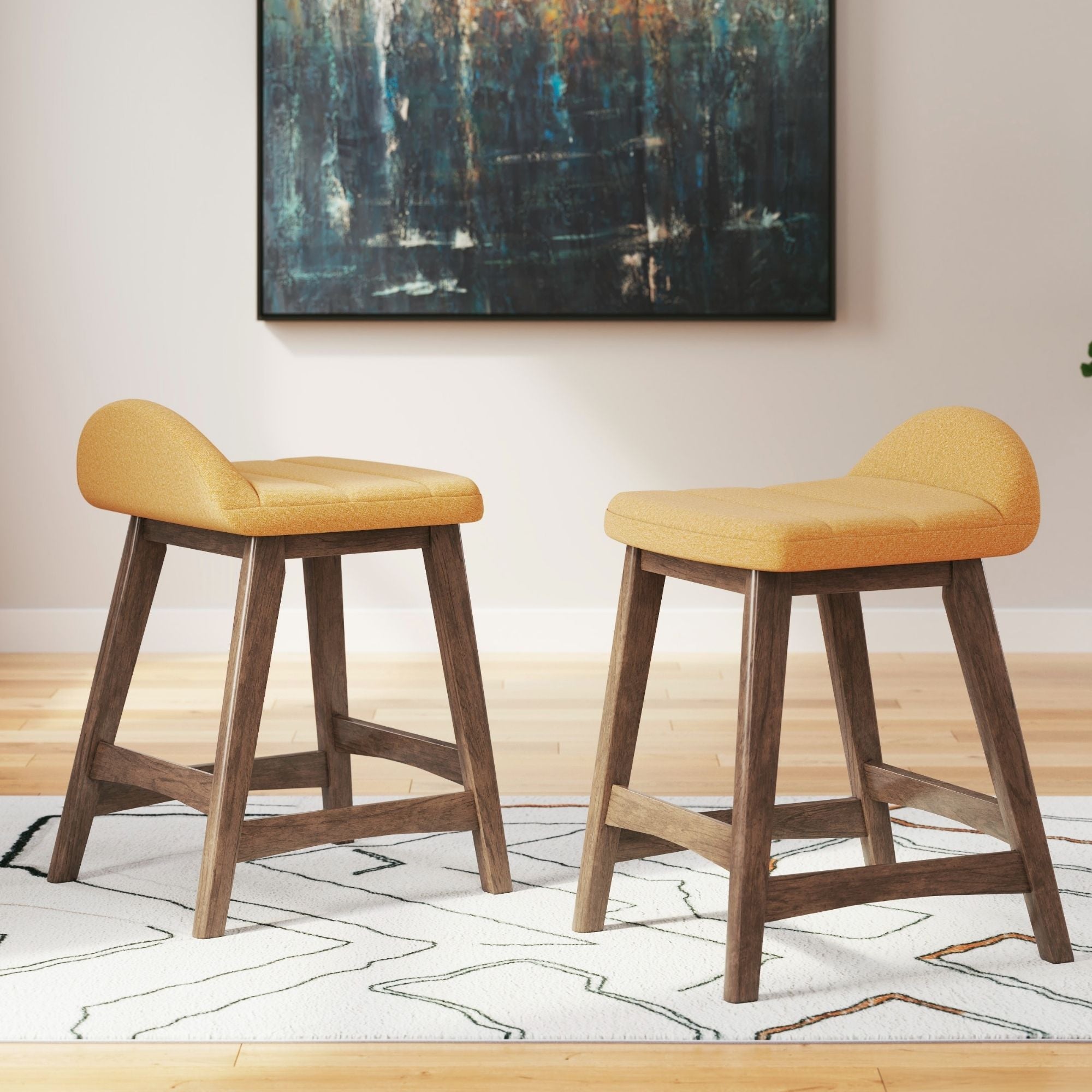 Set of two yellow upholstered Signature Ashley bar stools with wooden legs and padded seats, ideal for kitchen or bar area.