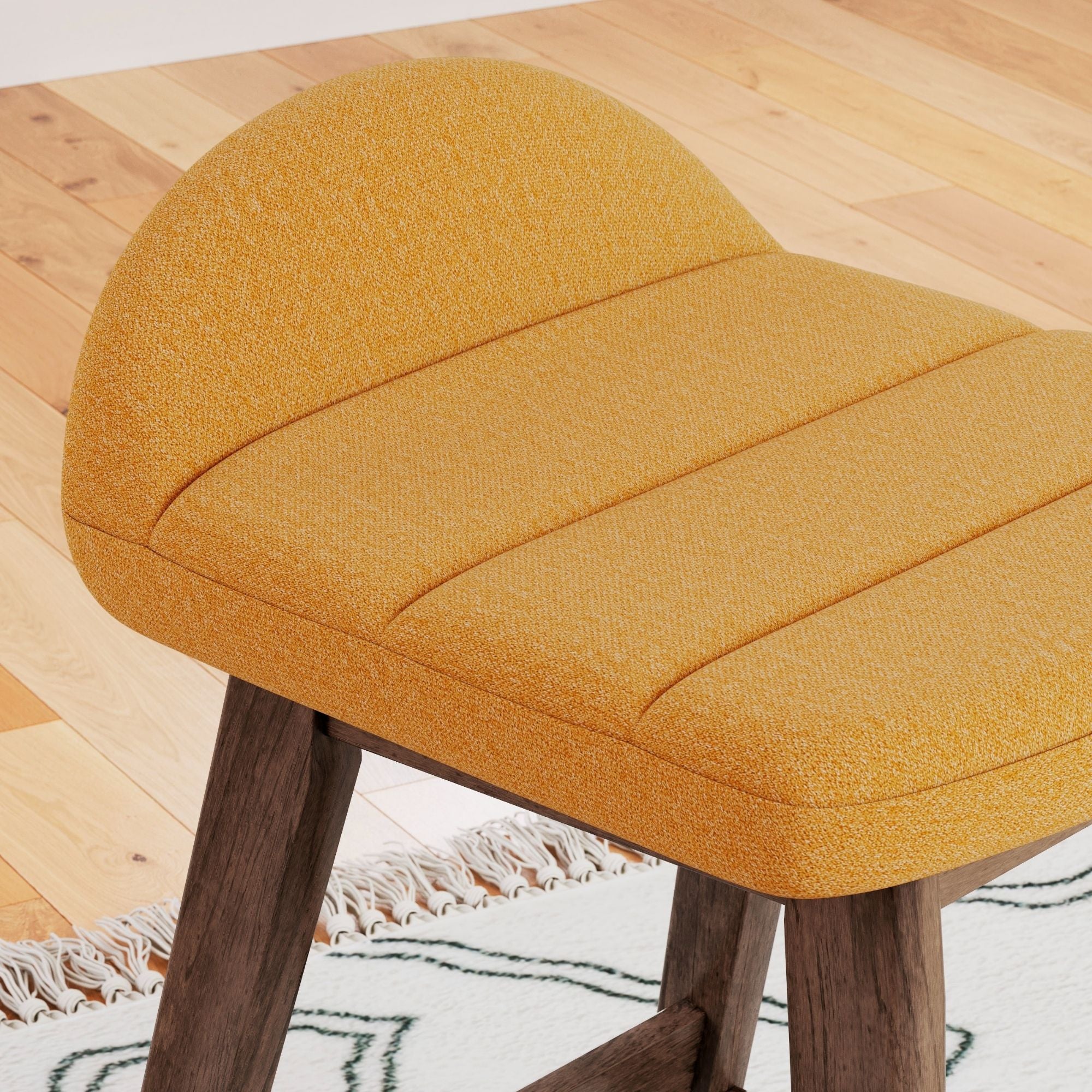 Set of two yellow upholstered Ashley Signature bar stools with wooden legs and modern design.