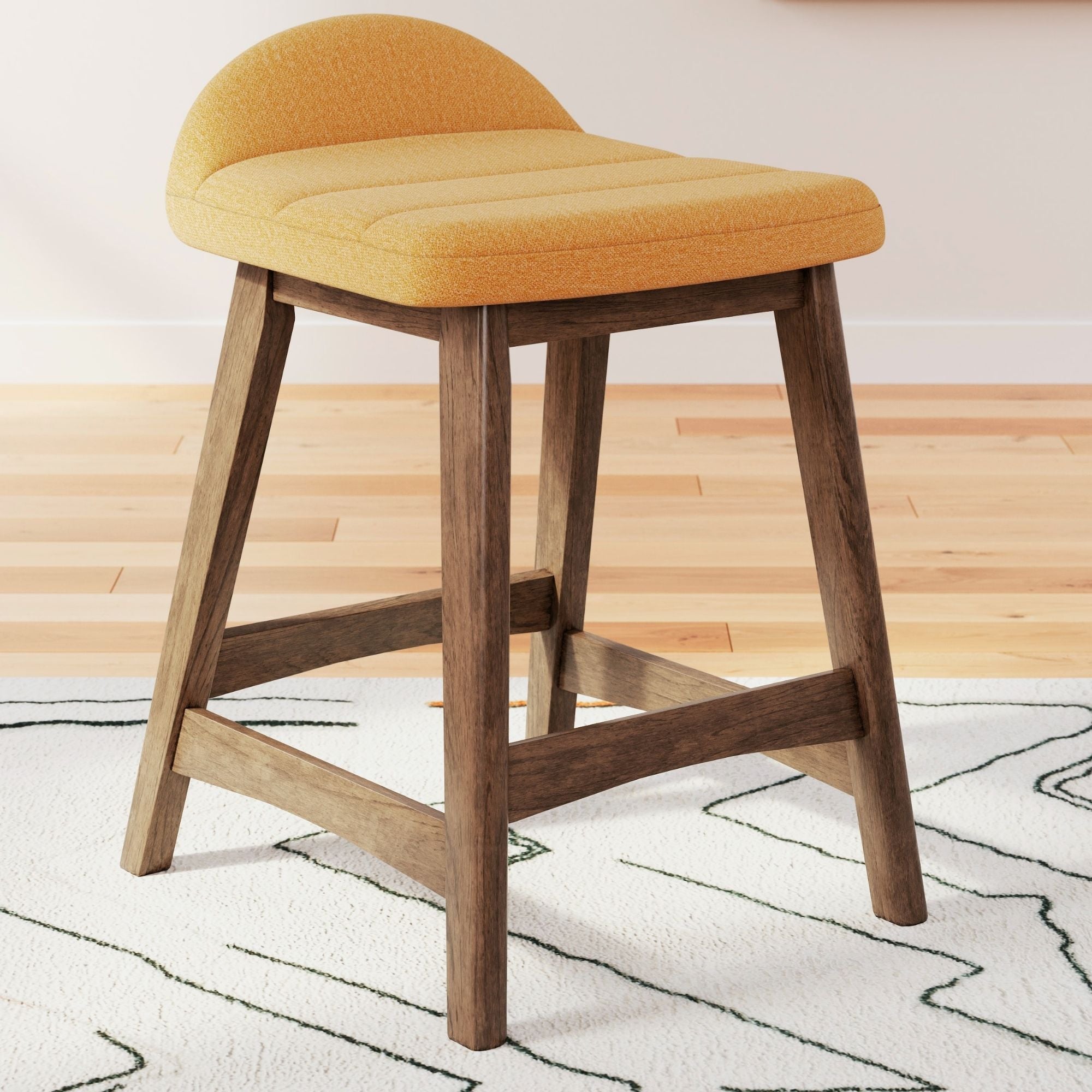 Two yellow upholstered Signature Ashley bar stools with wooden legs and a modern design, perfect for kitchen or bar area.