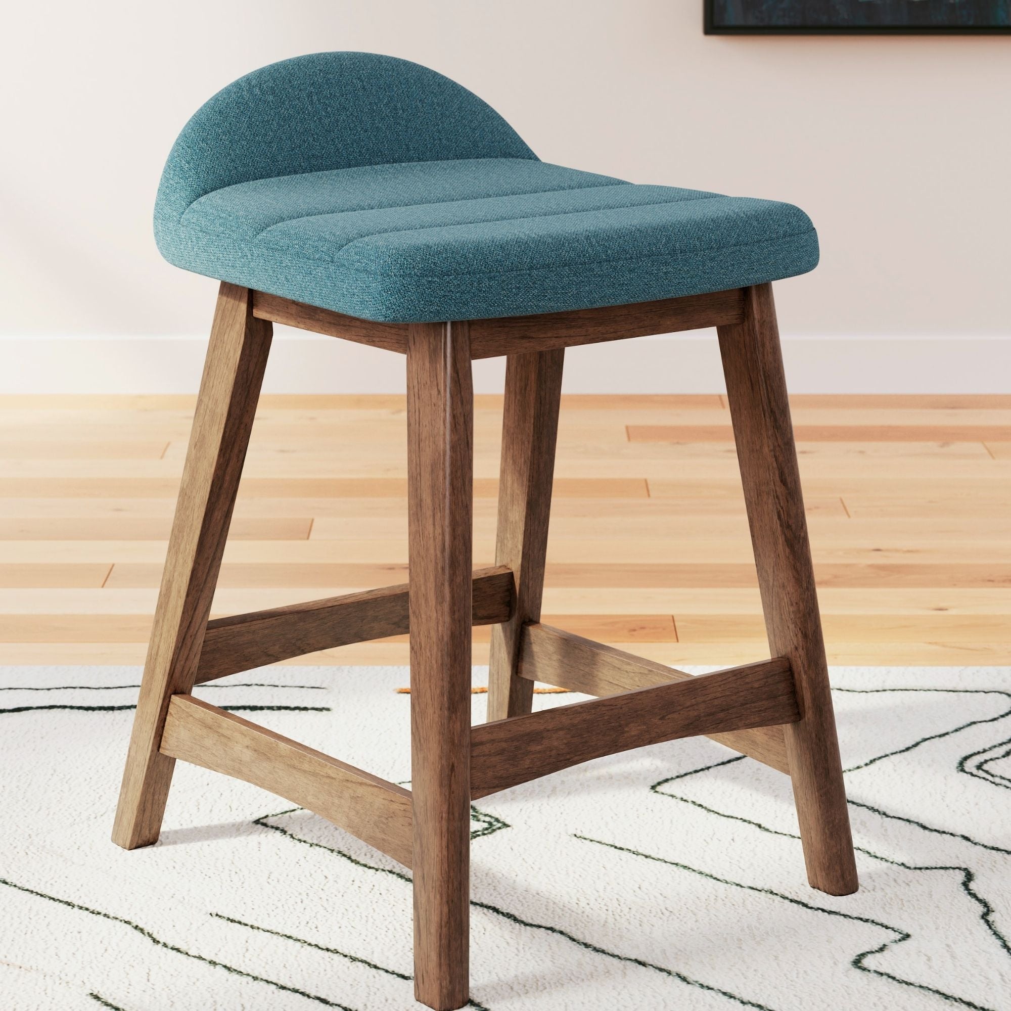 Set of two blue upholstered Signature Ashley barstools with wooden legs, modern design, ideal for kitchen or bar area.
