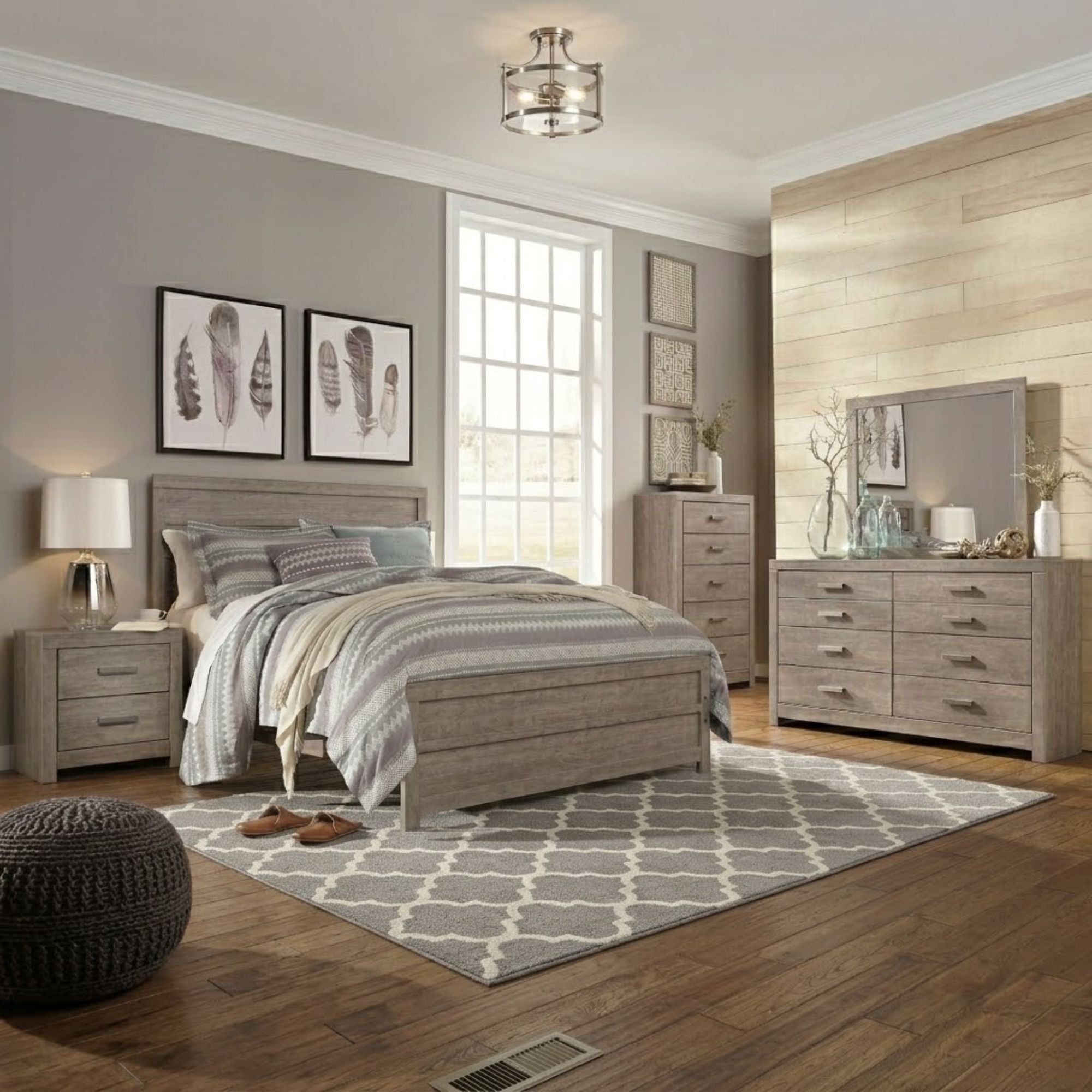 Gray Signature Ashley Culverbach bedroom set with a bed, matching nightstands, and dresser in a modern bedroom setting.