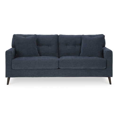 Navy Bixler sofa by Signature Design Ashley with plush cushions and modern design, shown in a living room setting.