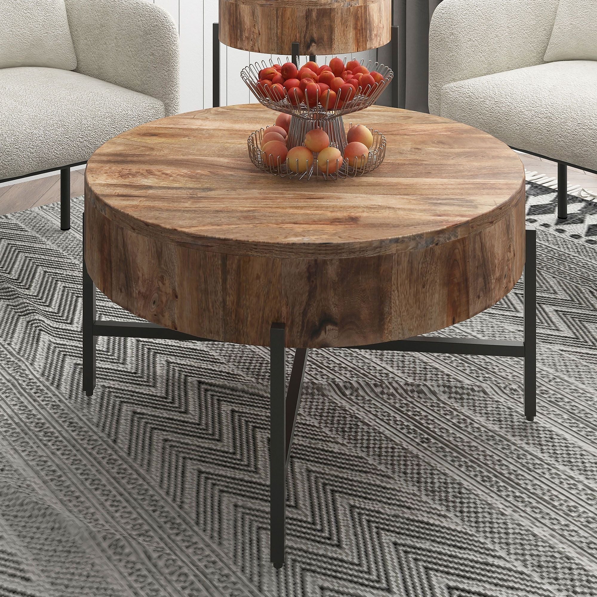 Modern Blox round coffee table in natural wood and black metal, featuring a sleek, minimalist design for contemporary living rooms.