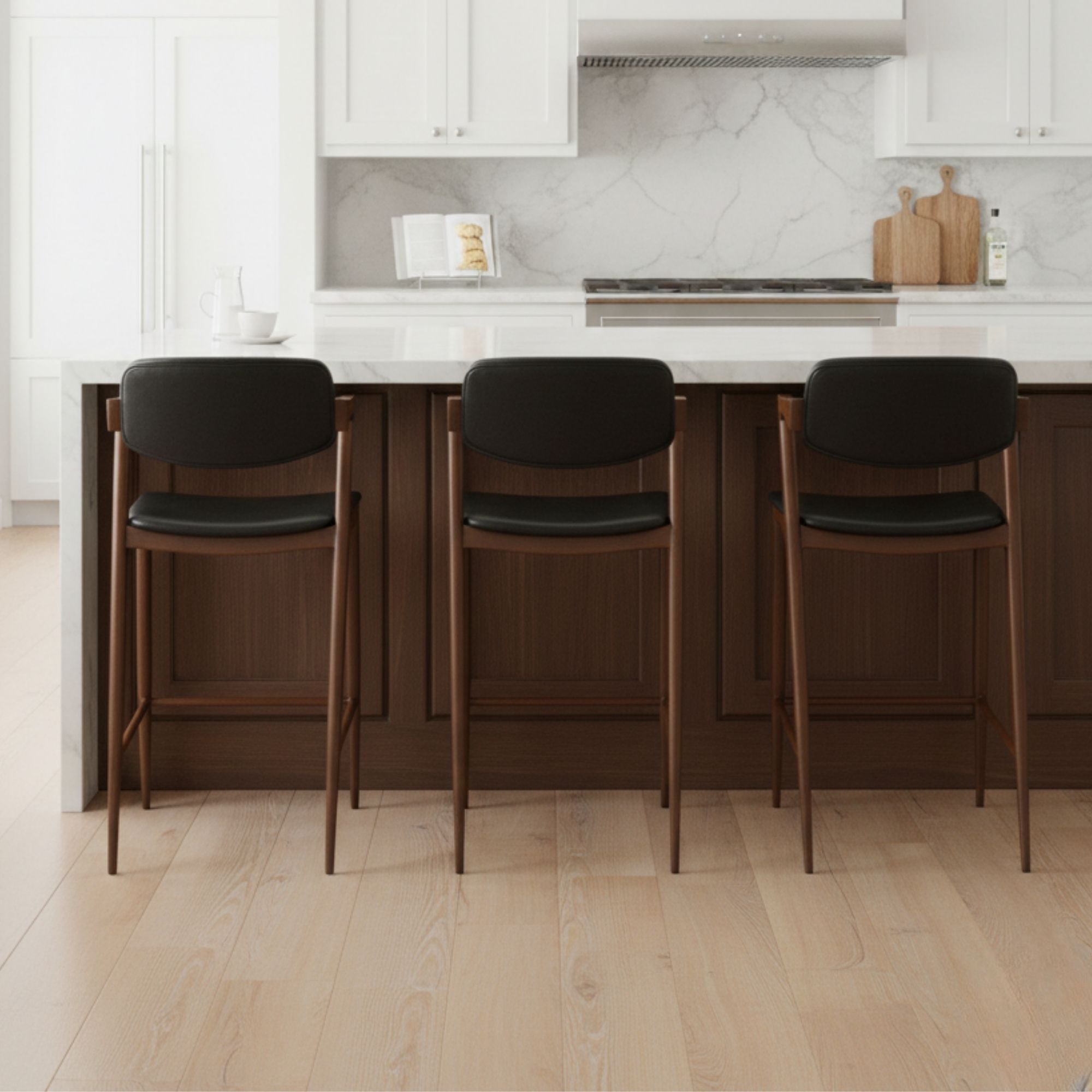 Black Brera Metal Counter Stool by Elite Living, showcasing a sleek modern bar stool design with a sturdy metal frame.