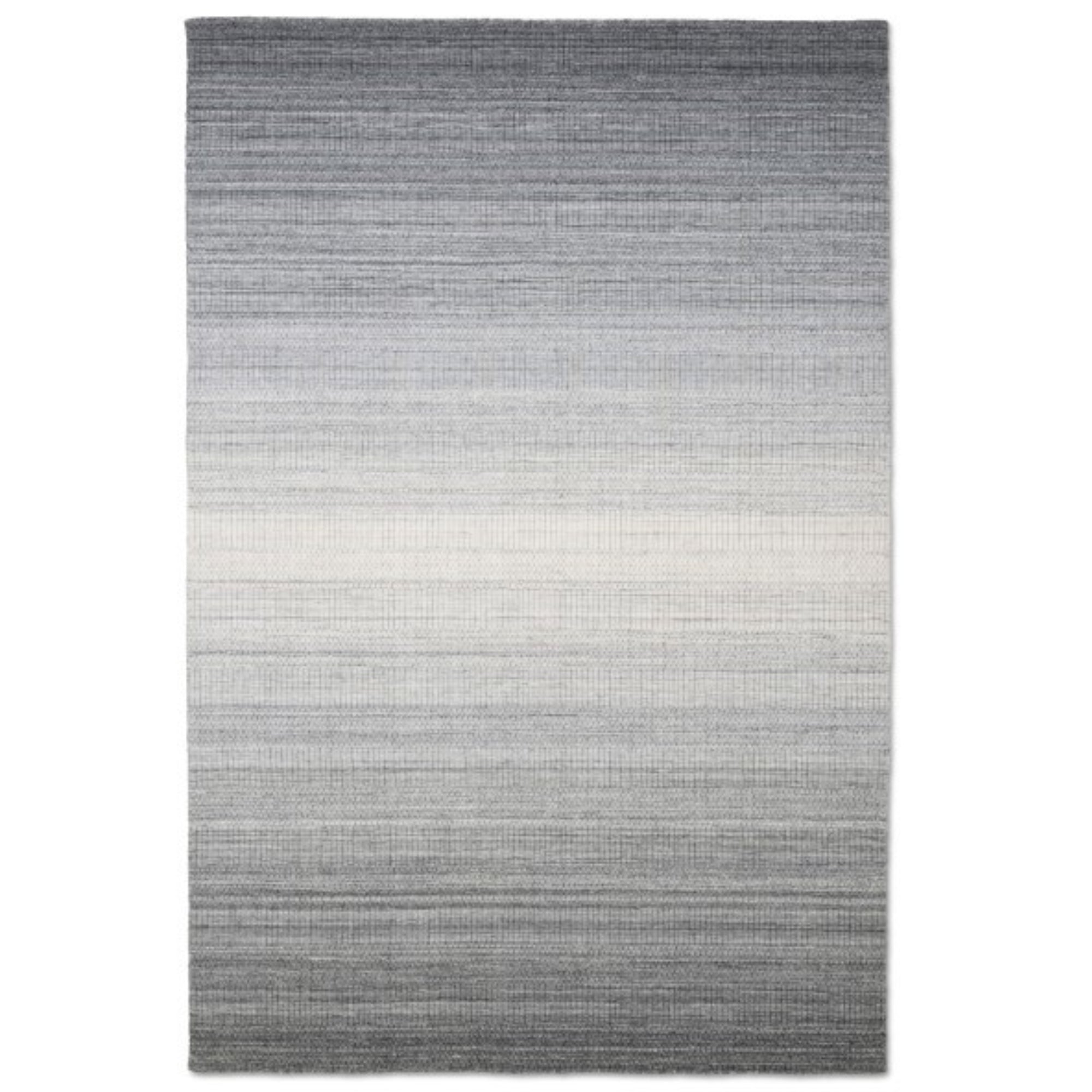 Viana Inc Celeste handloom area rug with intricate patterns in warm earthy tones, showcasing craftsmanship and detailed weaving.