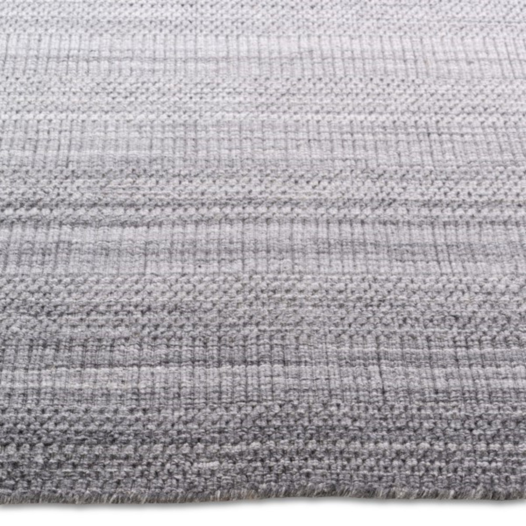 Viana Inc Celeste handloom area rug with intricate woven pattern in neutral tones, showcasing craftsmanship and detailed textile design.
