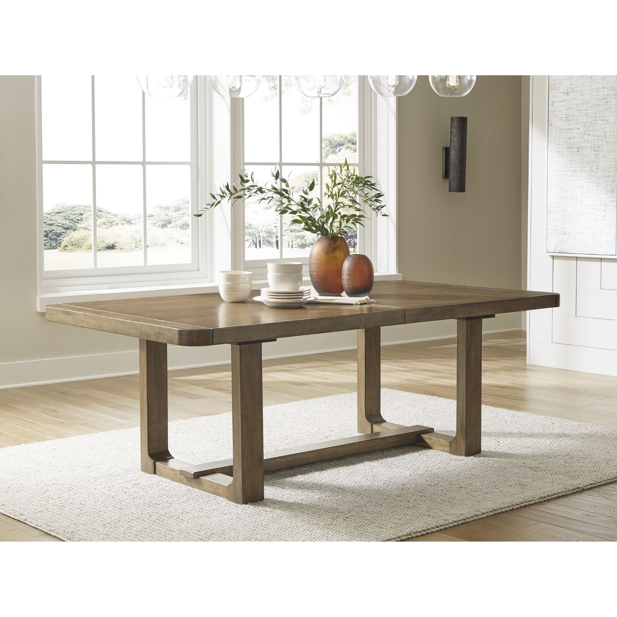 Cabalynn RECT dining room extension table by Signature Ashley, showing a modern wooden kitchen and dining table with extension leaves.