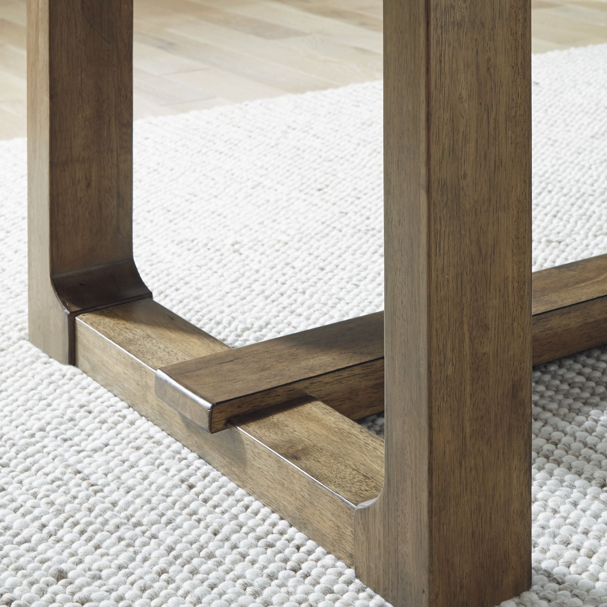 Cabalynn RECT dining room table by Signature Ashley with a wood finish, shown in a modern kitchen and dining area setting.