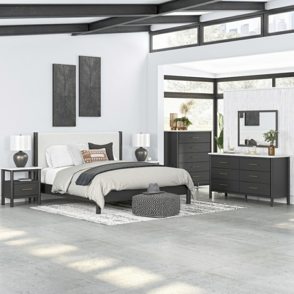 Black upholstered panel platform bedroom set by Signature Ashley, featuring a modern bed frame with clean lines and matching bedroom furniture.