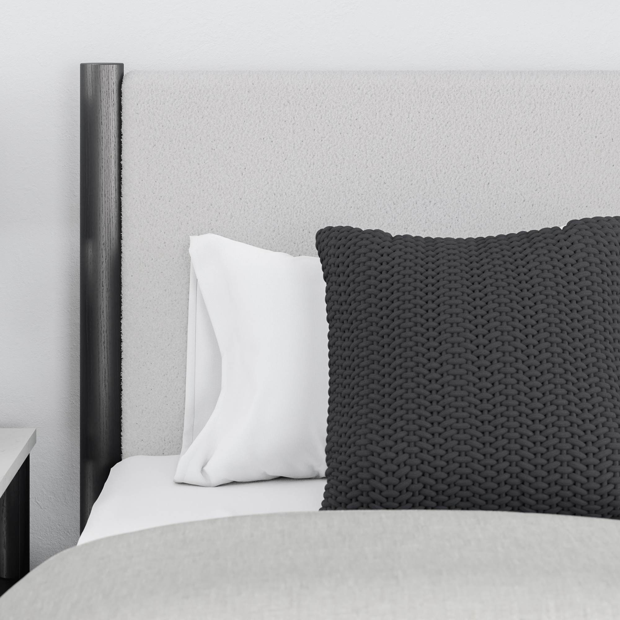 Black upholstered panel platform bed by Signature Ashley, featuring a modern design and clean lines for a stylish bedroom.