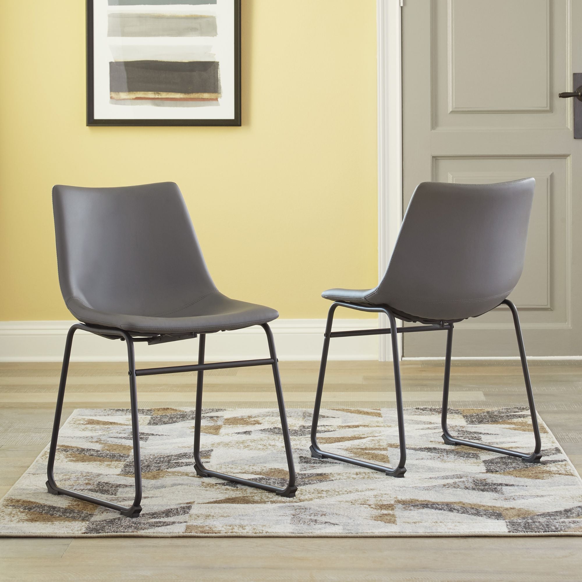 Set of two grey Centiar UPH dining chairs by Signature Ashley, showcasing modern upholstered dining room seating.