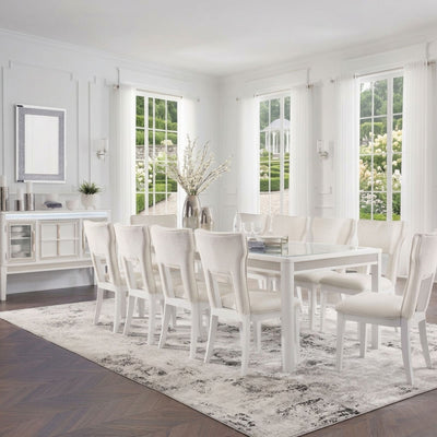 White Chalanna dining room set by Signature Ashley, featuring a table and matching chairs in a modern design.