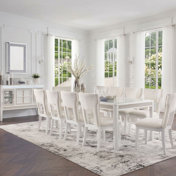 White Chalanna dining room set by Signature Ashley, featuring a table and matching chairs in a modern design.