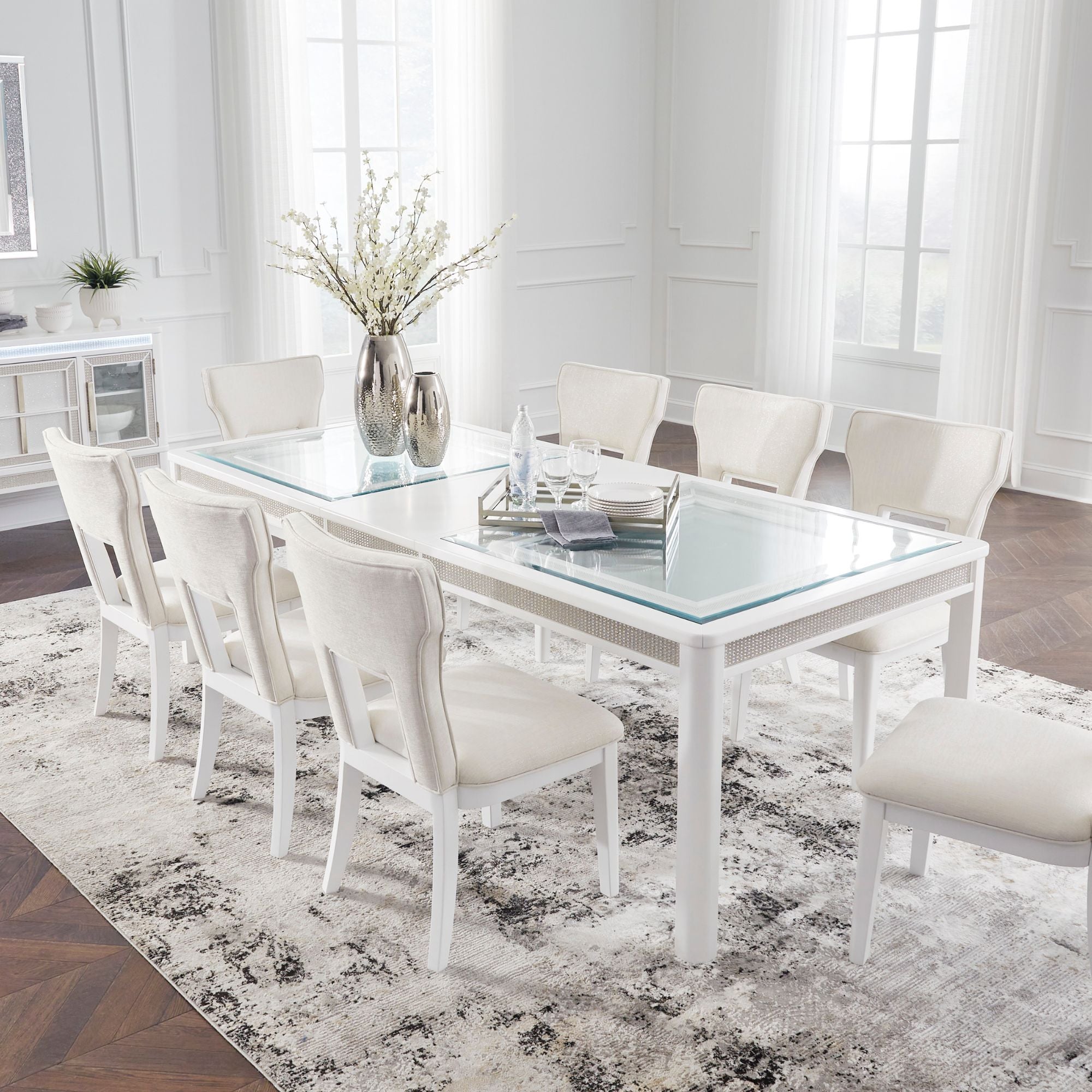 White Chalanna dining room set with a table and matching chairs from Signature Ashley, styled for a modern dining space.