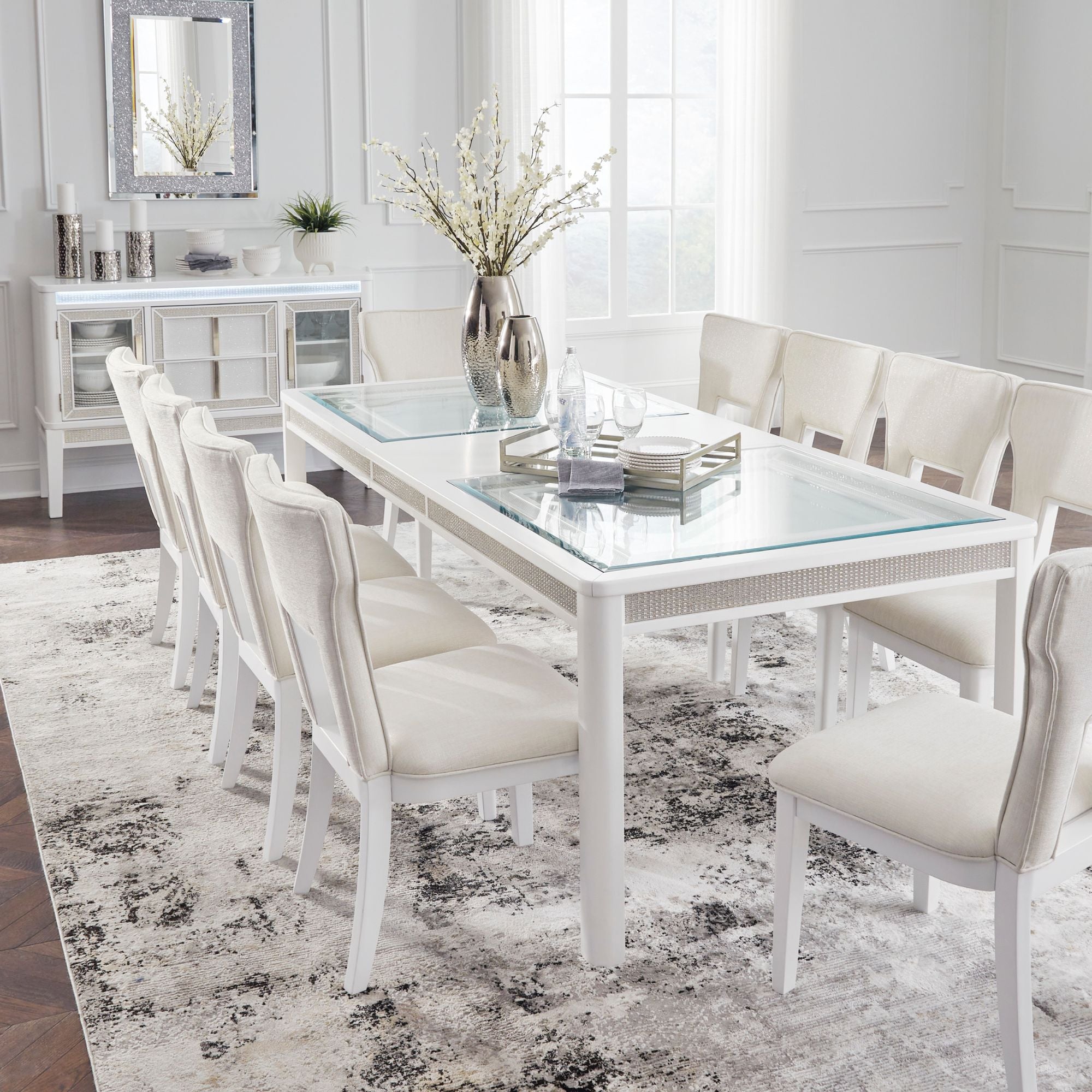 White Chalanna dining room set by Signature Ashley with a table and matching chairs, modern and elegant for dining spaces.