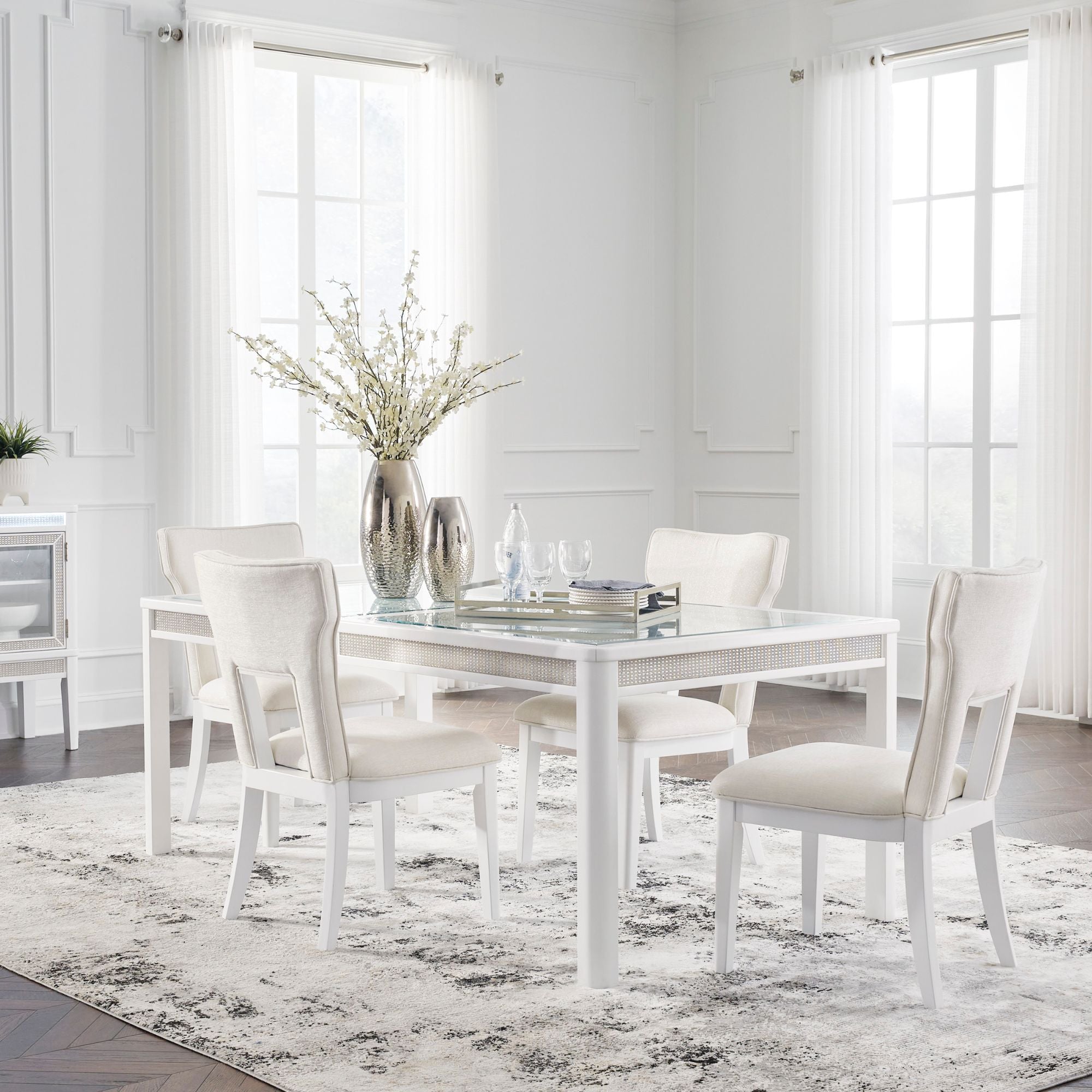 White Chalanna dining room set by Signature Ashley featuring a table and matching chairs in a modern design.