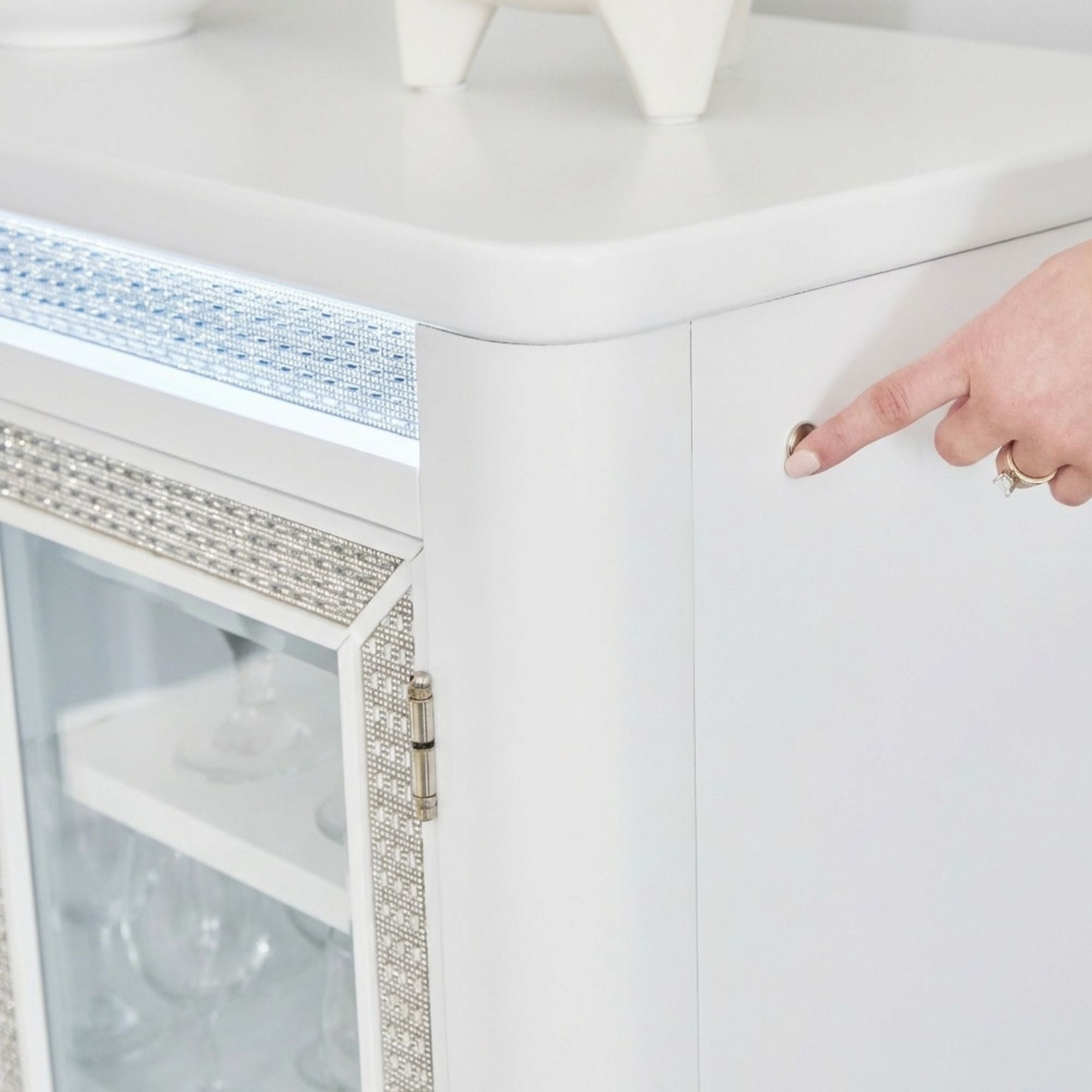 White Chalanna dining room server by Signature Ashley with storage drawers and cabinet doors, featuring a sleek modern design.