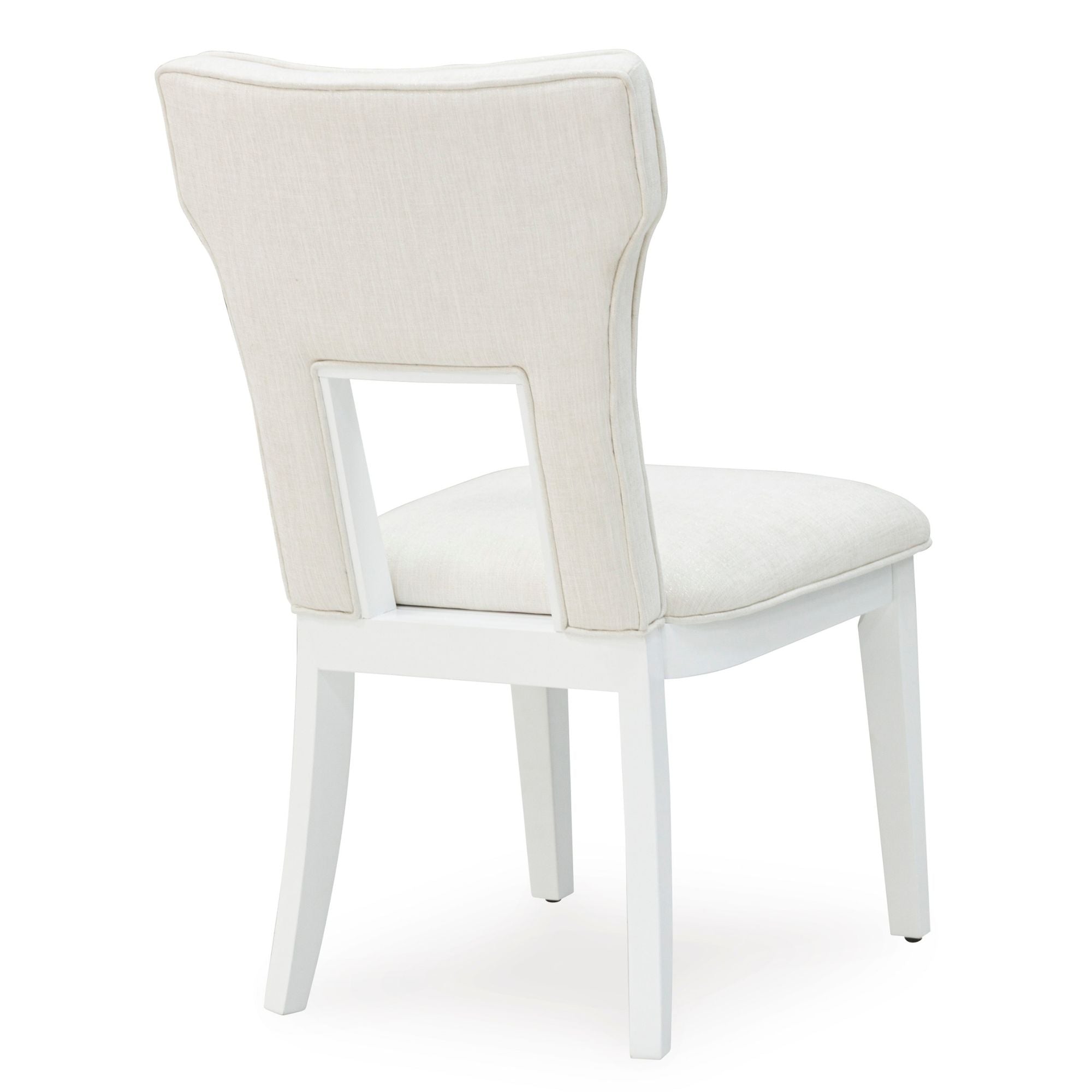 White Chalanna dining room set by Signature Ashley with a table and matching chairs, modern and elegant for contemporary dining spaces.