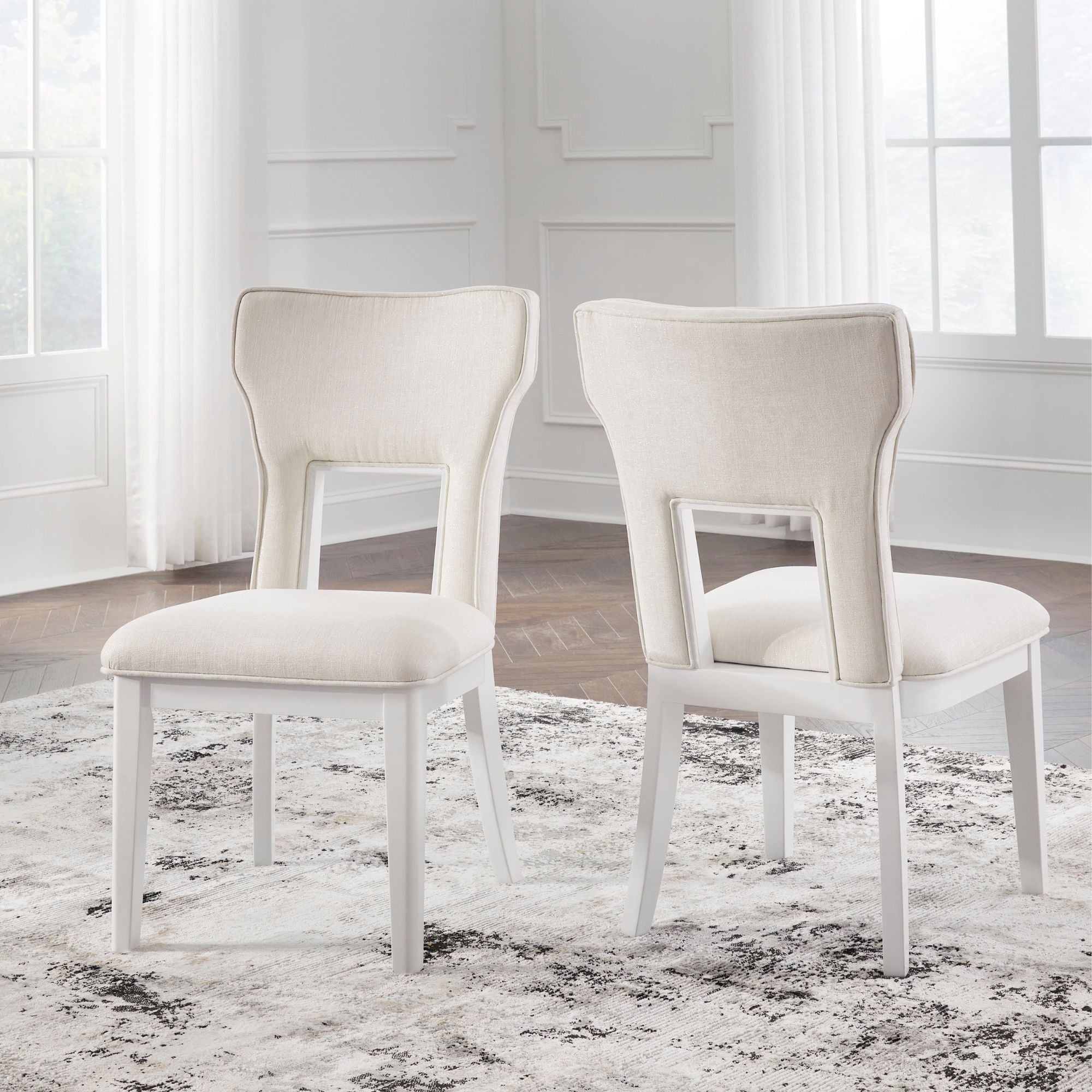 White Chalanna dining room set by Signature Ashley featuring a table and matching chairs in a modern dining furniture design.