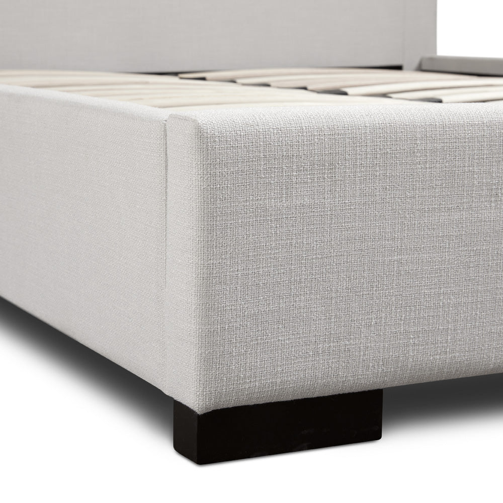 Xcella Channel Upholstery Bed frame with a modern, upholstered base and clean lines, shown from the side view.